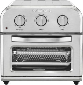 Discover one of the best stainless steel air fryers: a sleek Cuisinart oven with two dials for temperature and mode settings. Its transparent front window reveals a wire basket inside, making cooking efficiency easy to monitor. The trusted brand "Cuisinart" is proudly displayed at the top.