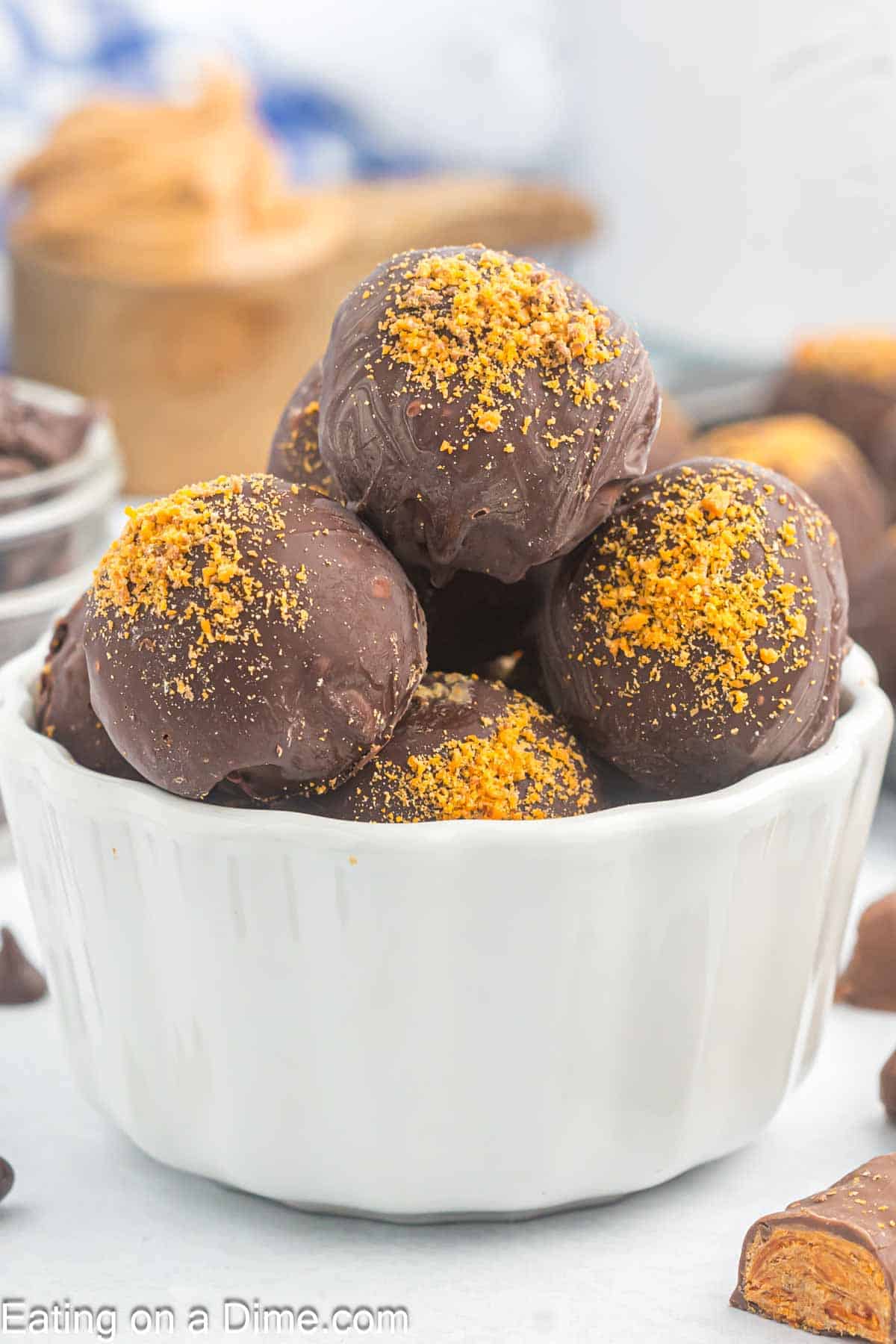 Butterfinger Balls stacked in a white bowl
