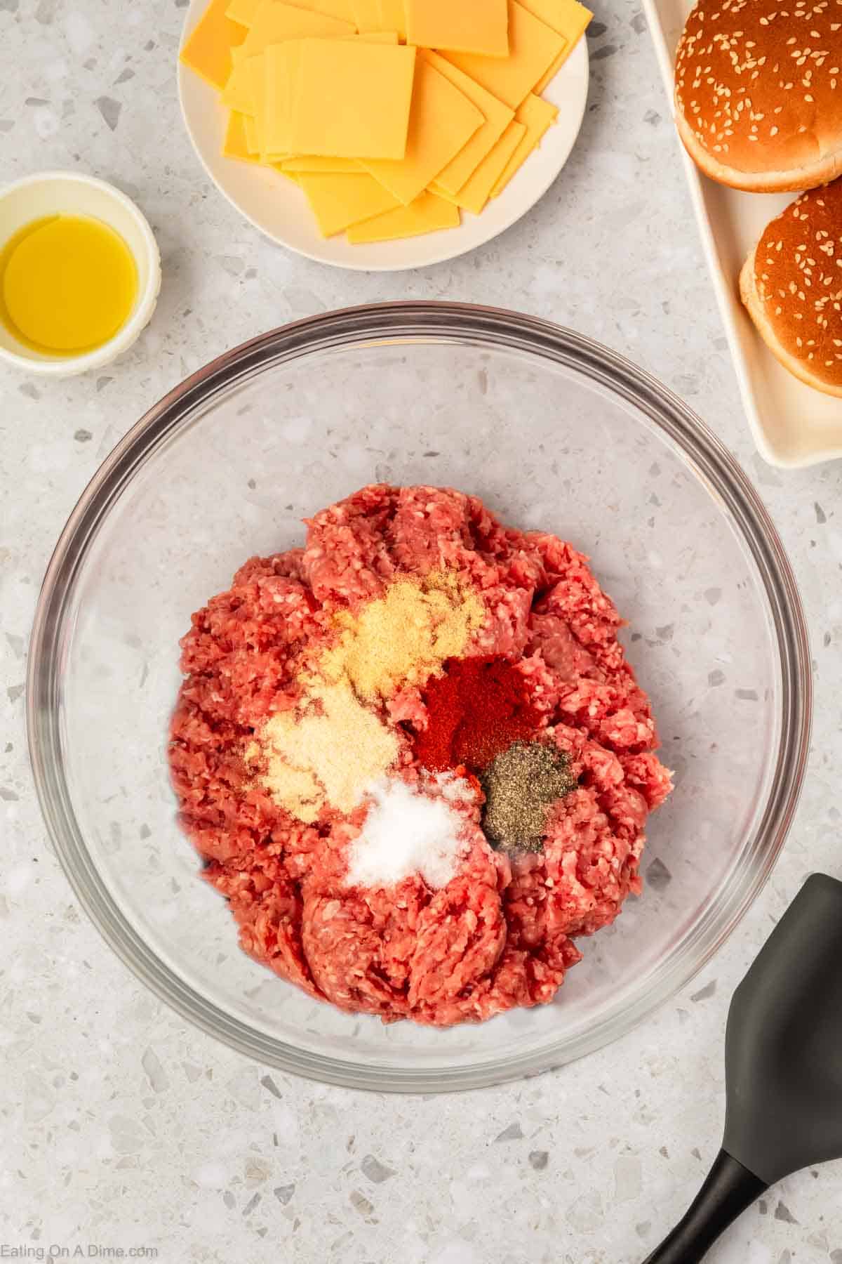 Ground beef in a bowl topped with seasoning