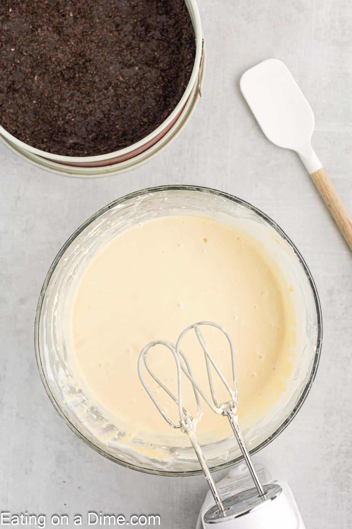 Mix in sour cream and heavy cream to the cream cheese mixture with a hand mixer