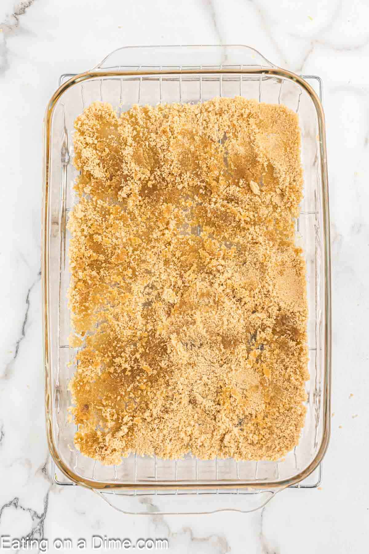 Brown sugar in melted butter in a glass baking dish