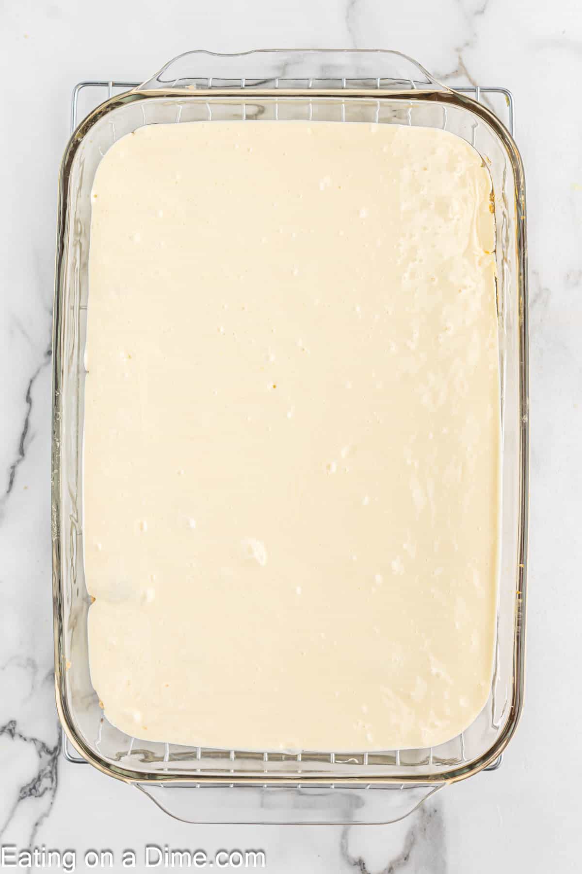 Pouring the cake mix in the prepared baking dish