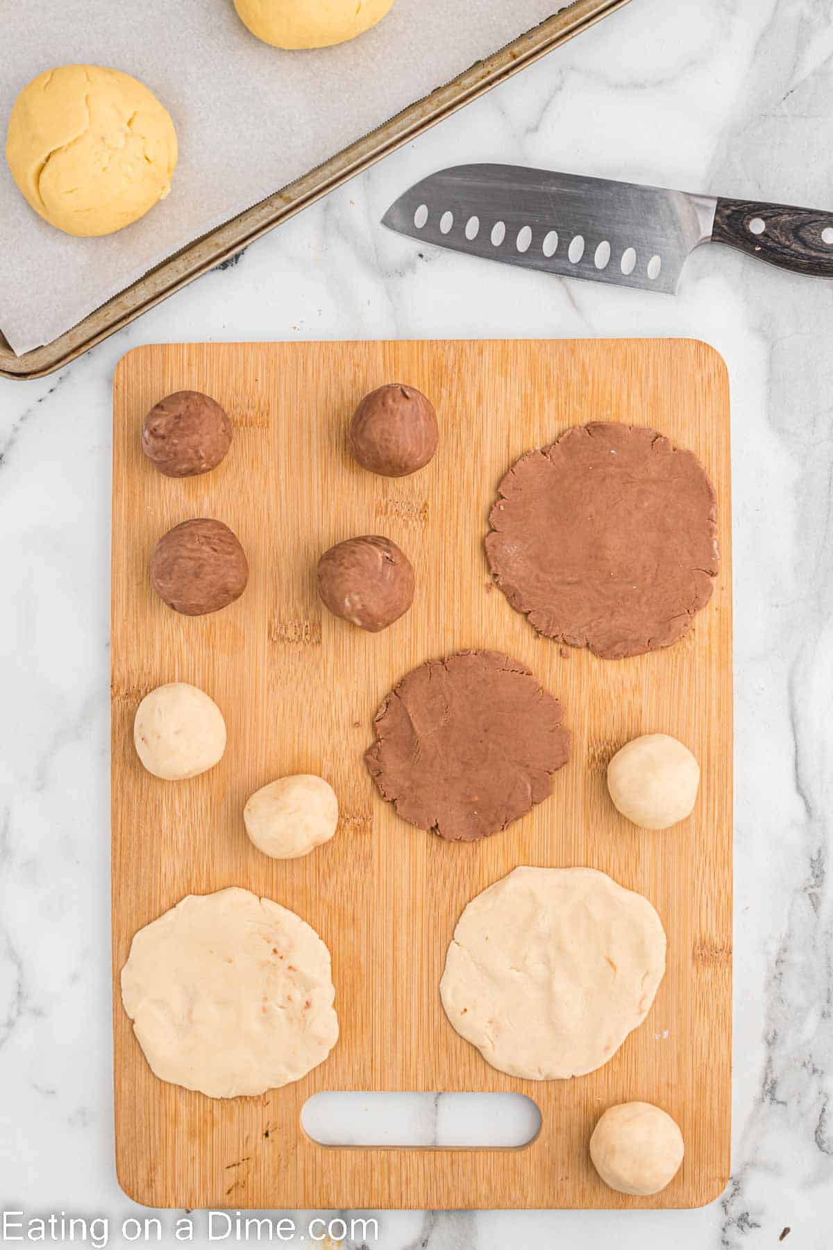 Chocolate dough balls on a cutting board