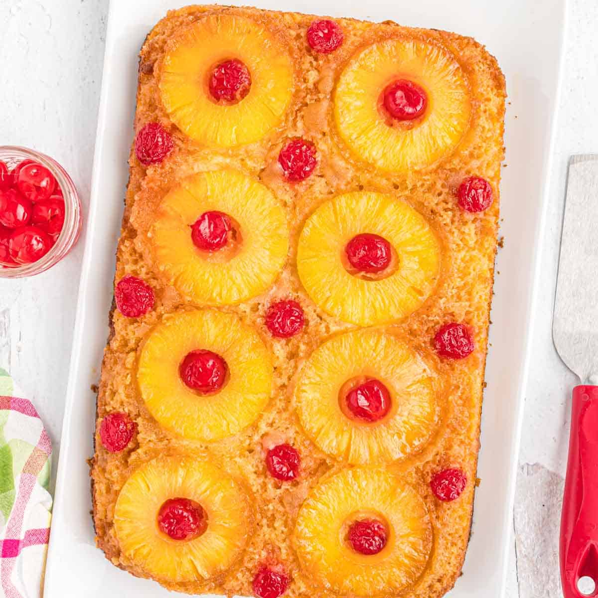 Pineapple upside cake on a white platter