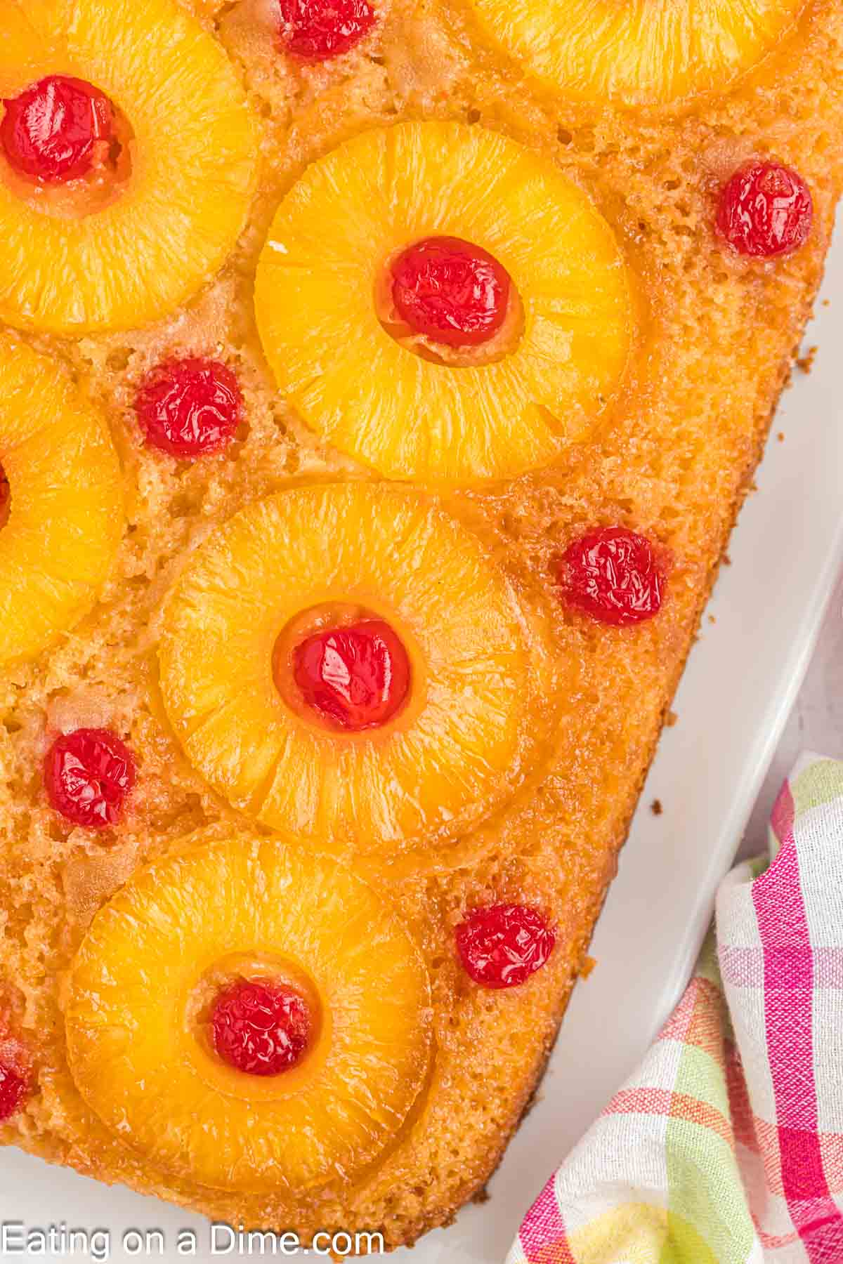 Pineapple upside cake on a white platter