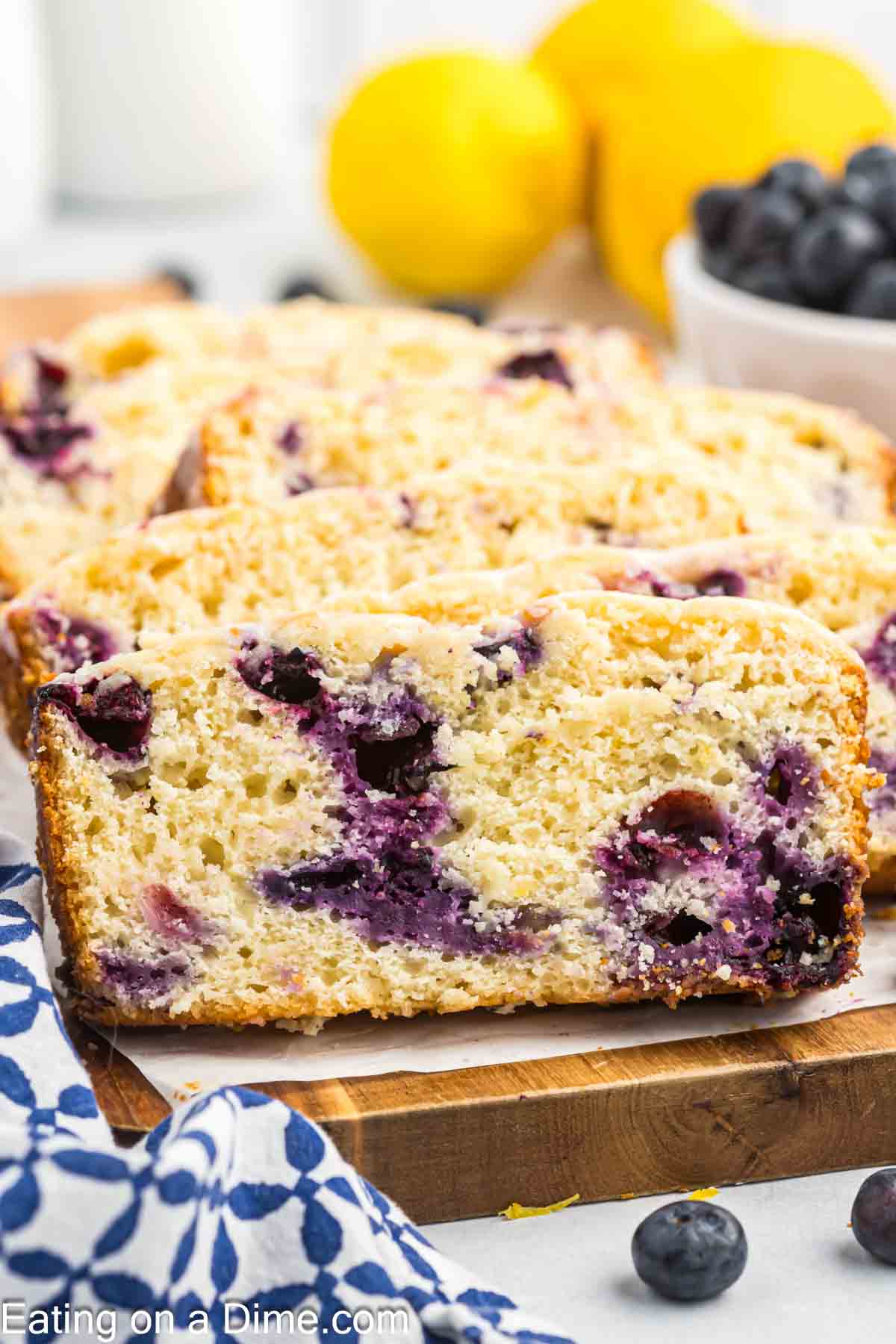 Slices of lemon blueberry bread on a cutting board