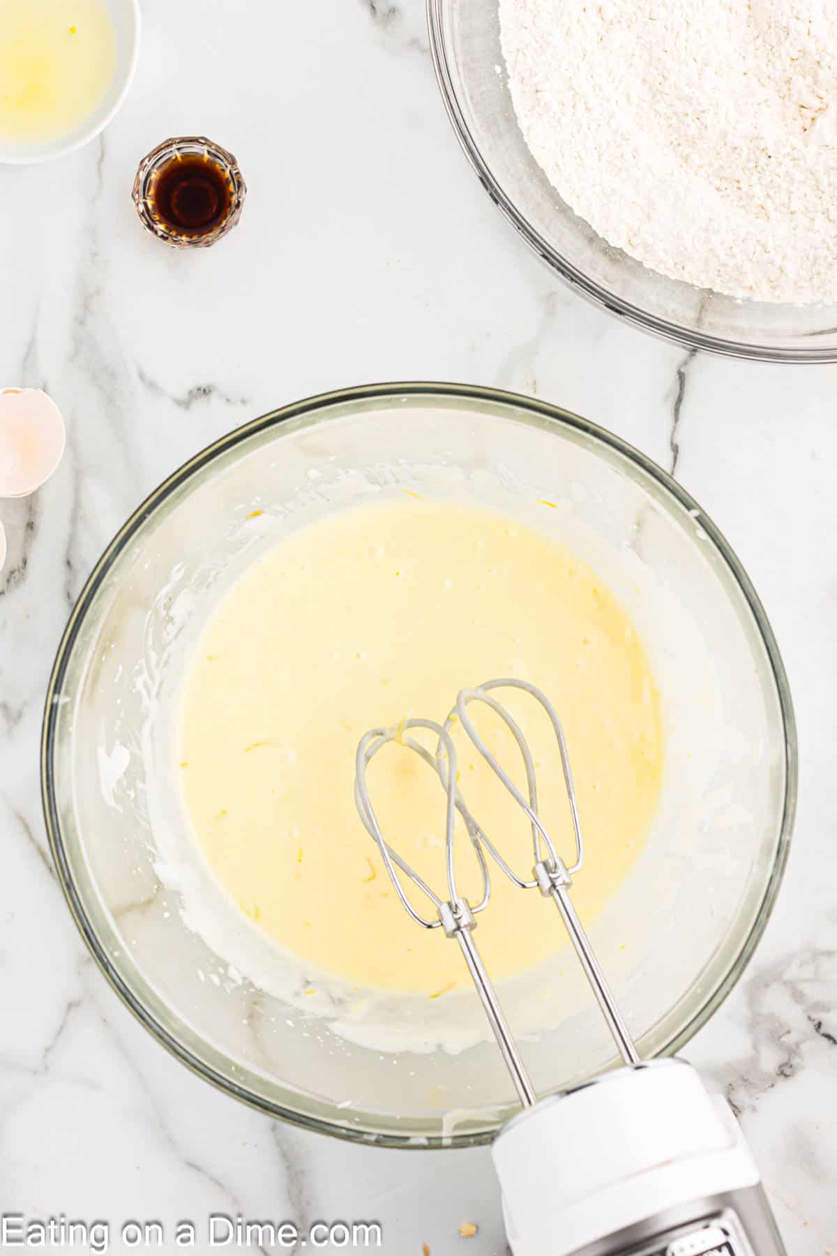 Adding in the eggs to the sugar mixture