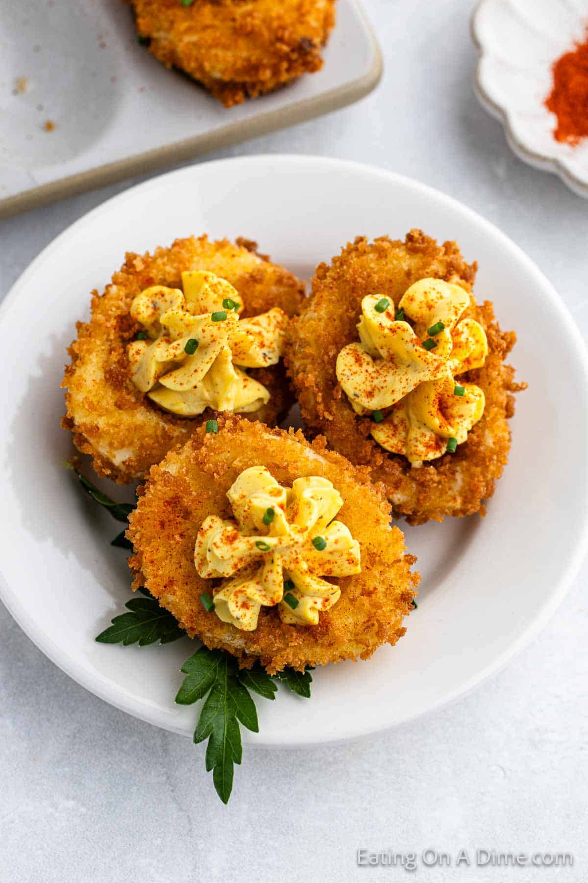 Fried Deviled Eggs on a white plate