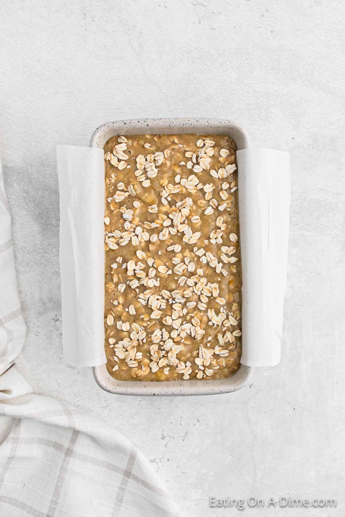 Topping bread batter with oats in the loaf pan