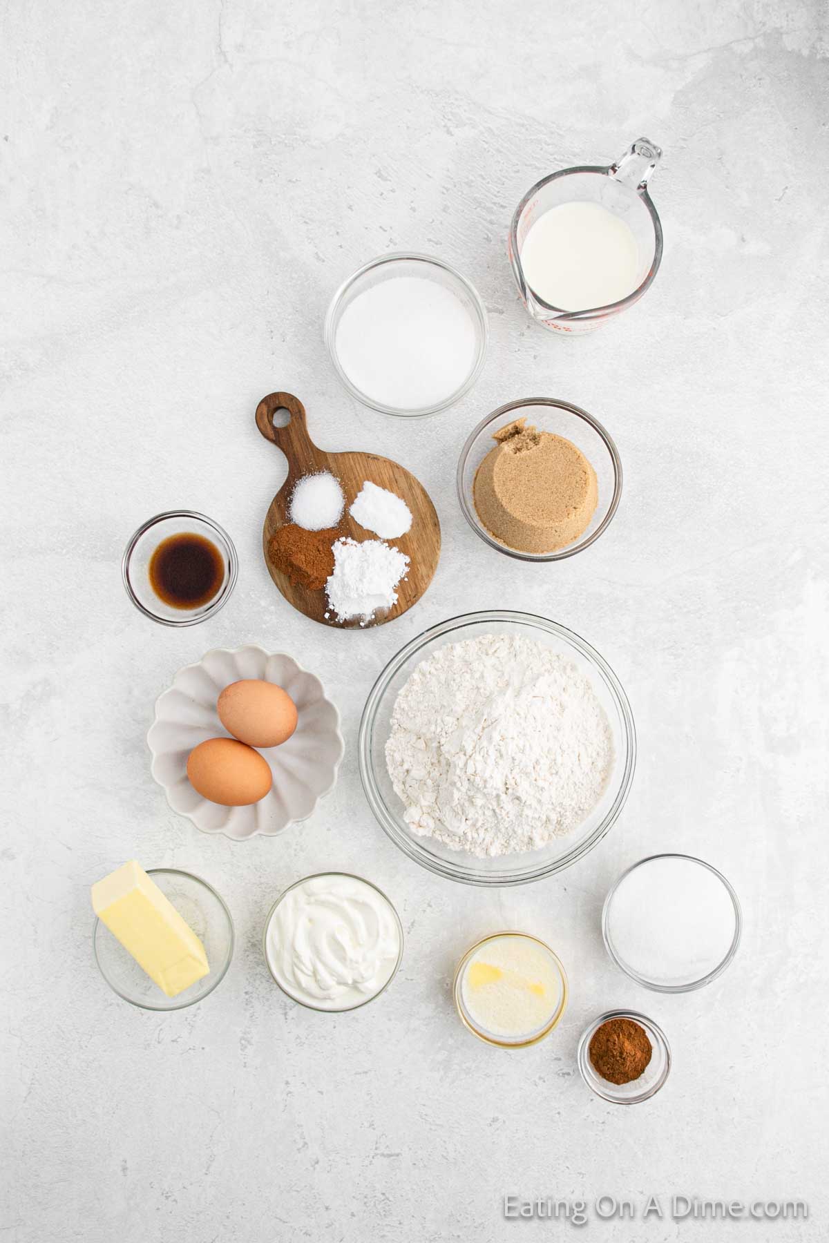Snickerdoodle muffins ingredients - flour, butter, sugar, brown sugar, eggs, milk, sour cream, vanilla, cinnamon, baking powder, baking soda, salt, 