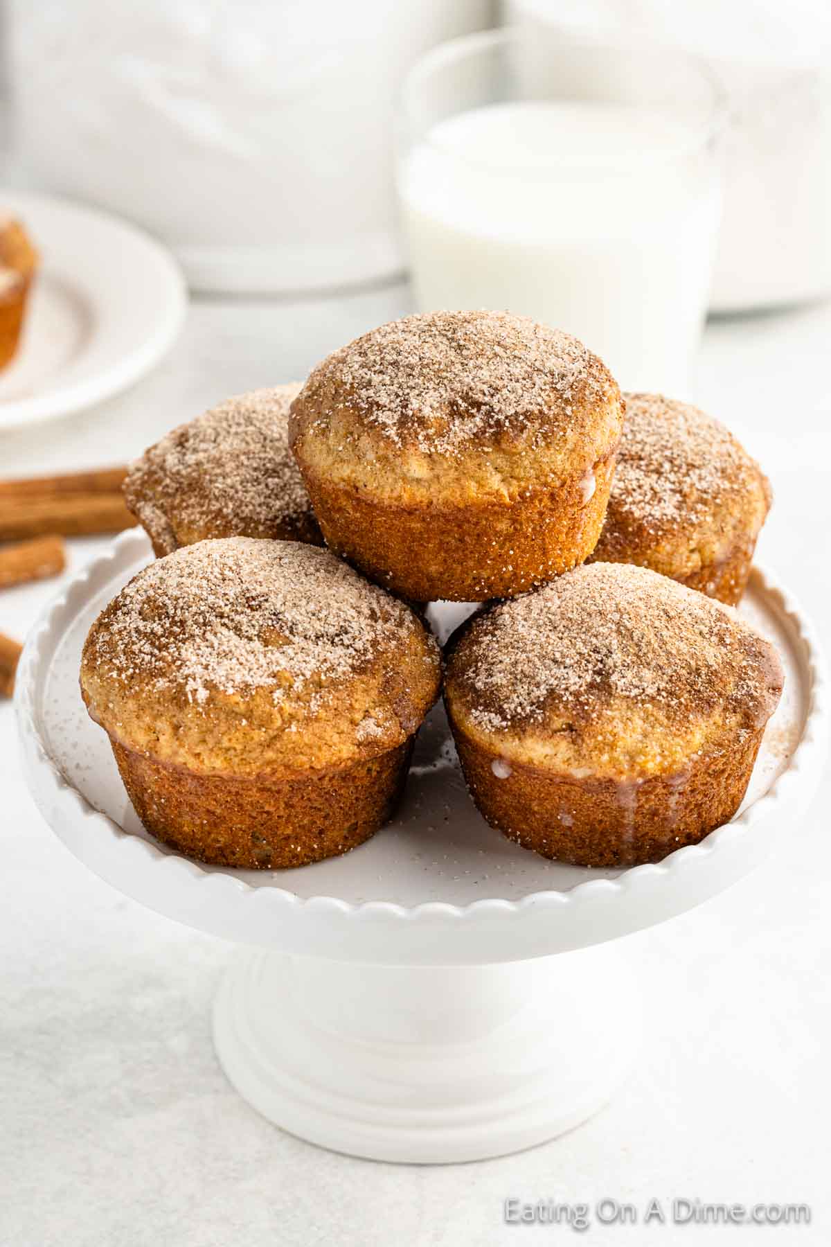 Snickerdoodle Muffins stacked on a plate