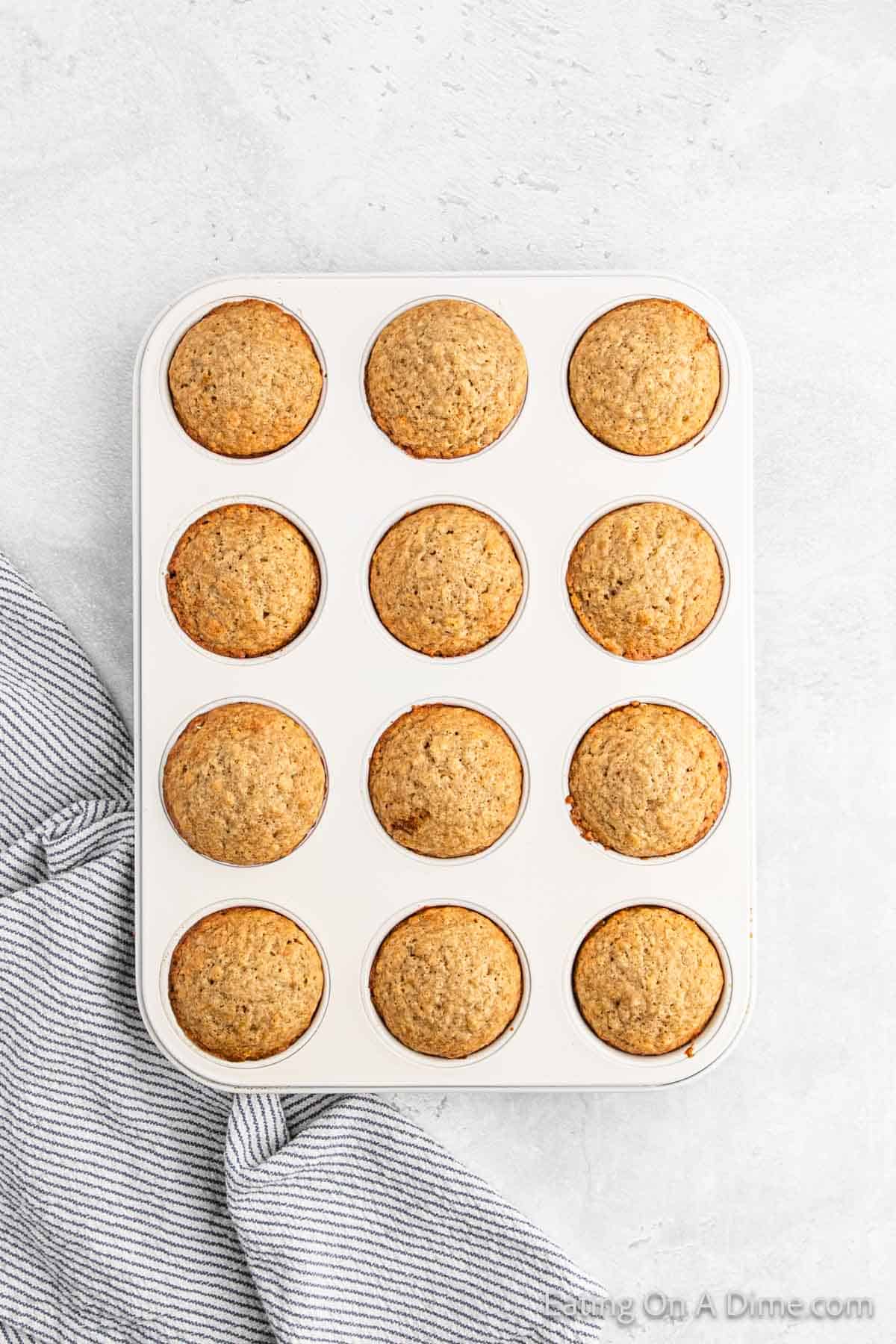 Baked Snickerdoodle Muffins in a muffin pan