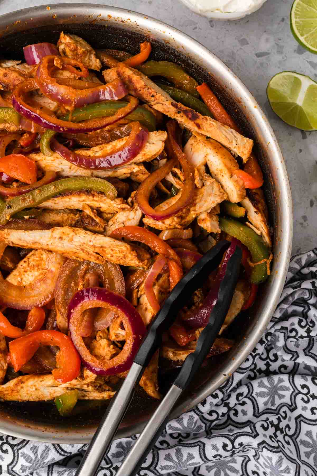 Chicken Fajita in a large skillet with peppers and onions