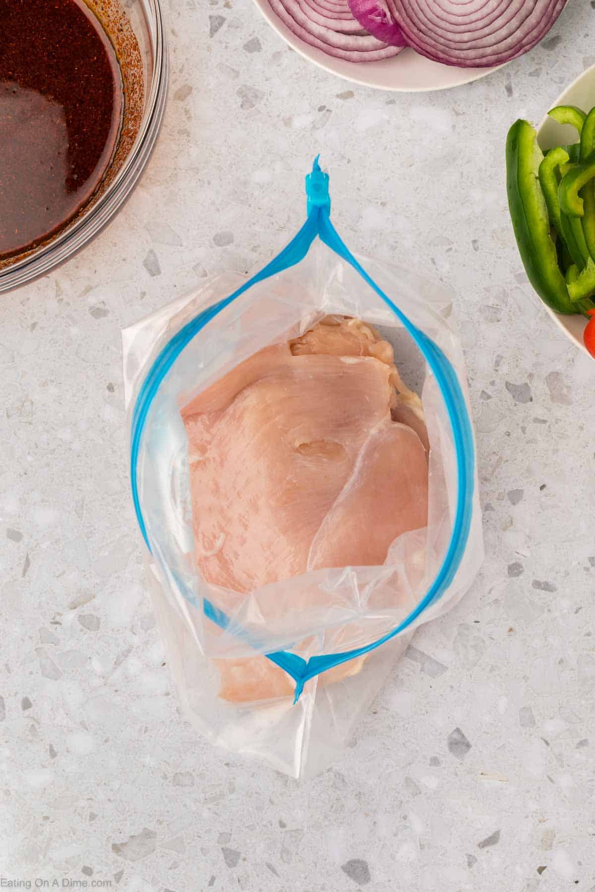 Chicken breast stacked in a ziplock bag