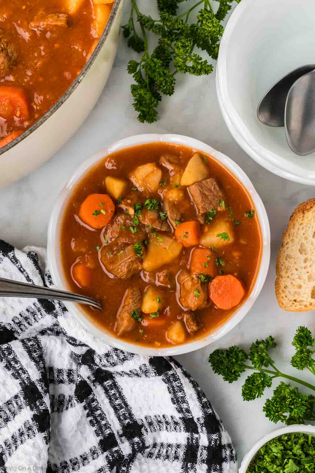 Hungarian goulash in a bowl with carrots, potatoes, meat in a red broth