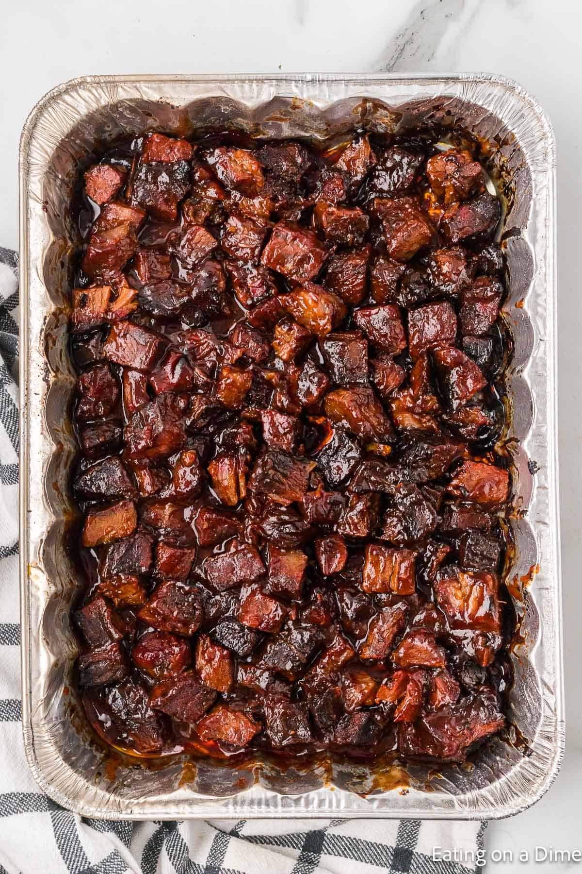 Smoked burnt ends in a foil pan