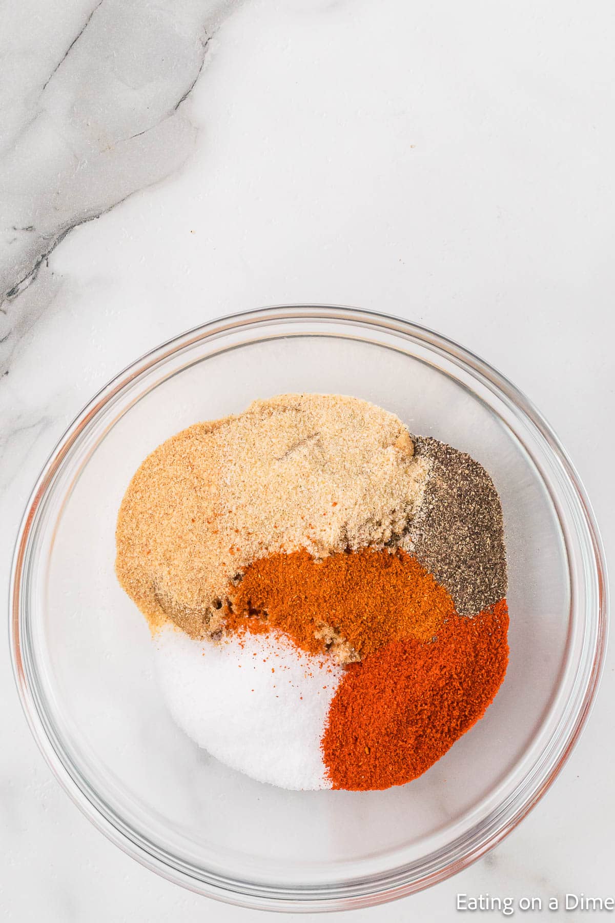 Blending the spices together in a bowl