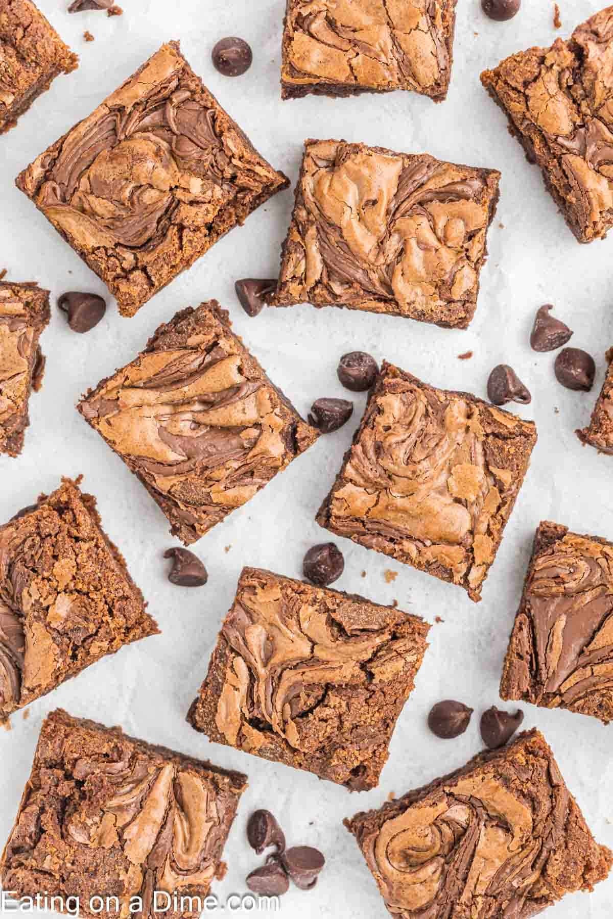 Nutella Brownies cut into squares with chocolate chips