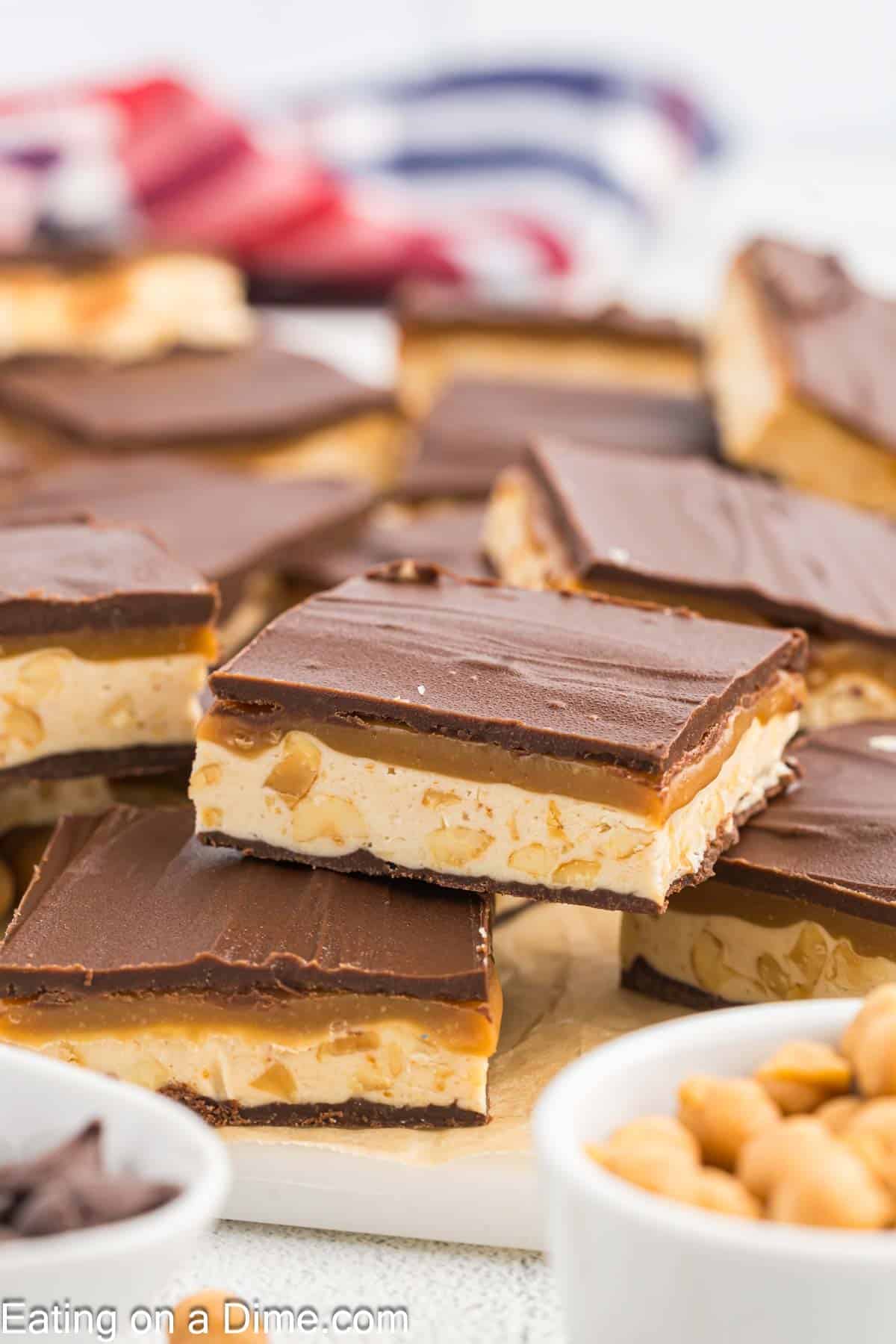 Homemade Snickers cut into squares and stacked