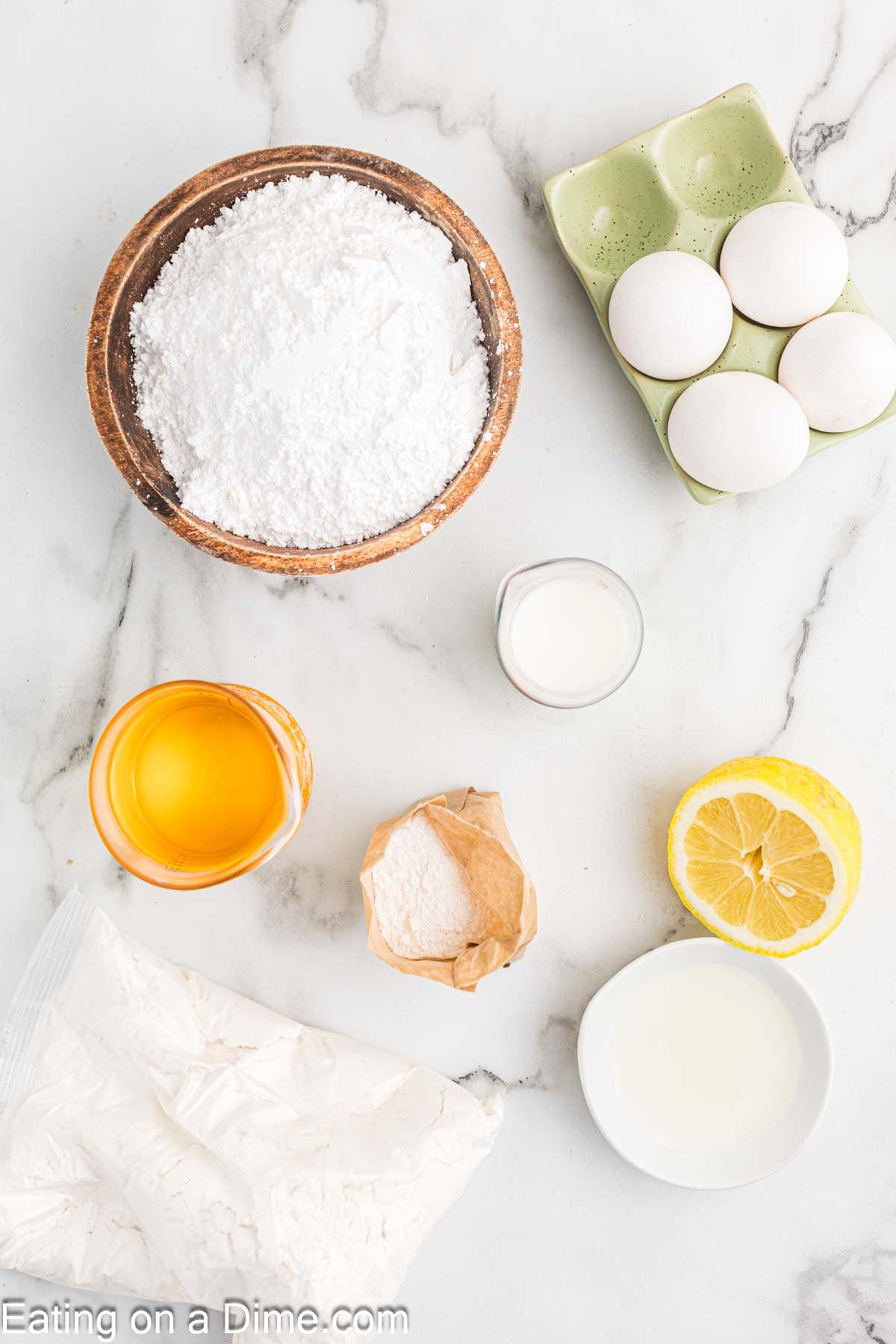 Powdered sugar, eggs, lemon, cake mix, instant lemon pudding, oil, milk