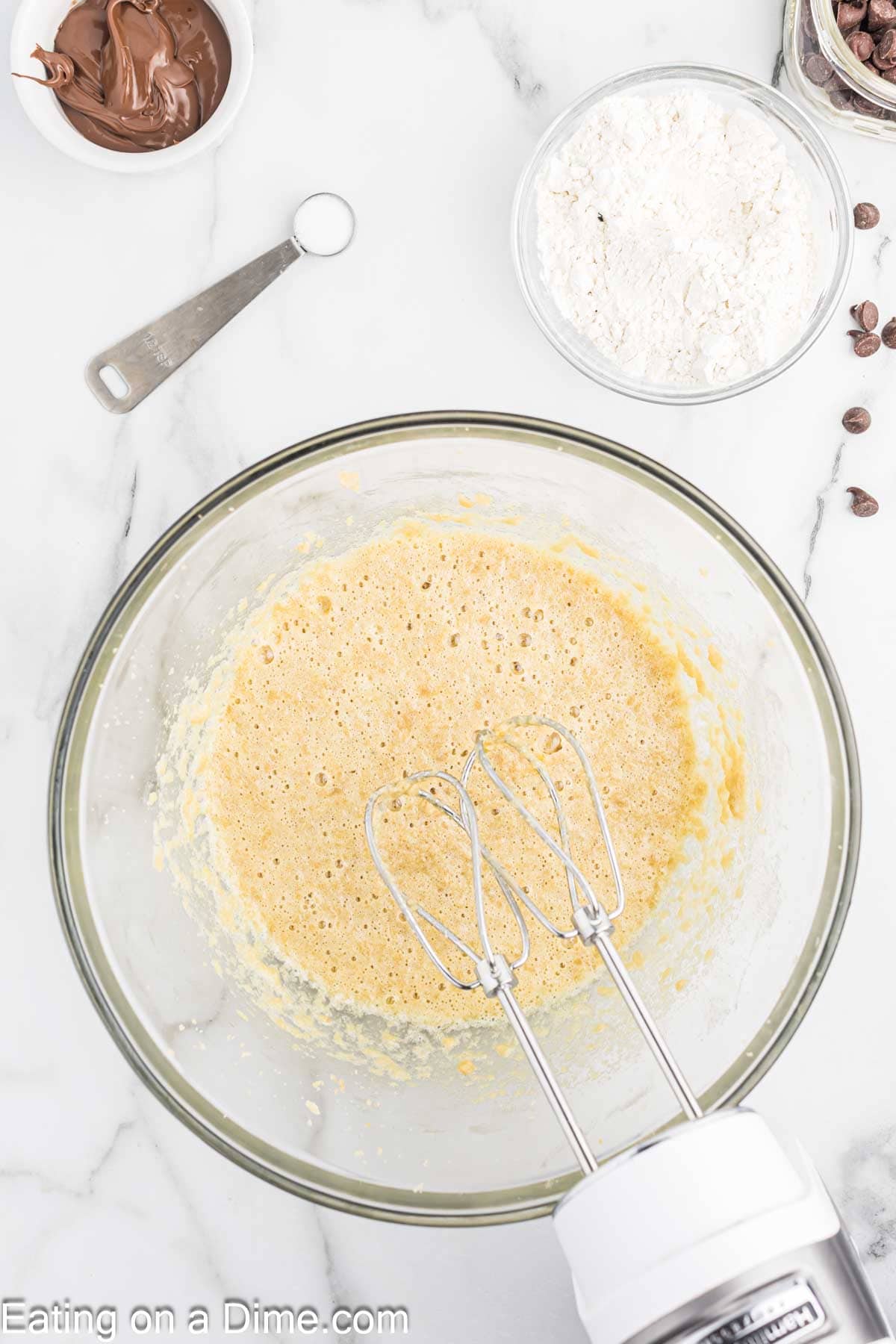 Mixing the eggs and vanilla extract in the brown sugar mixture in a bowl