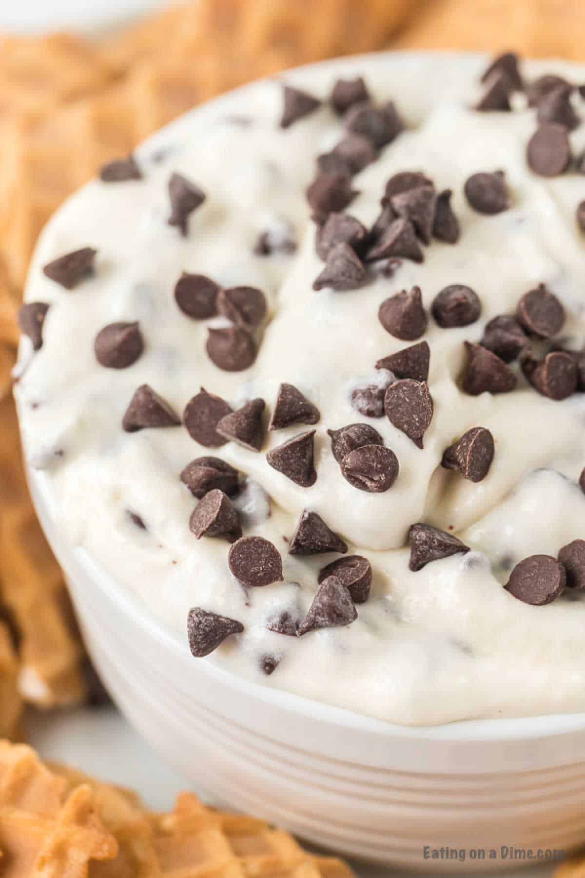 Cannoli Dip in a bowl topped with chocolate chips