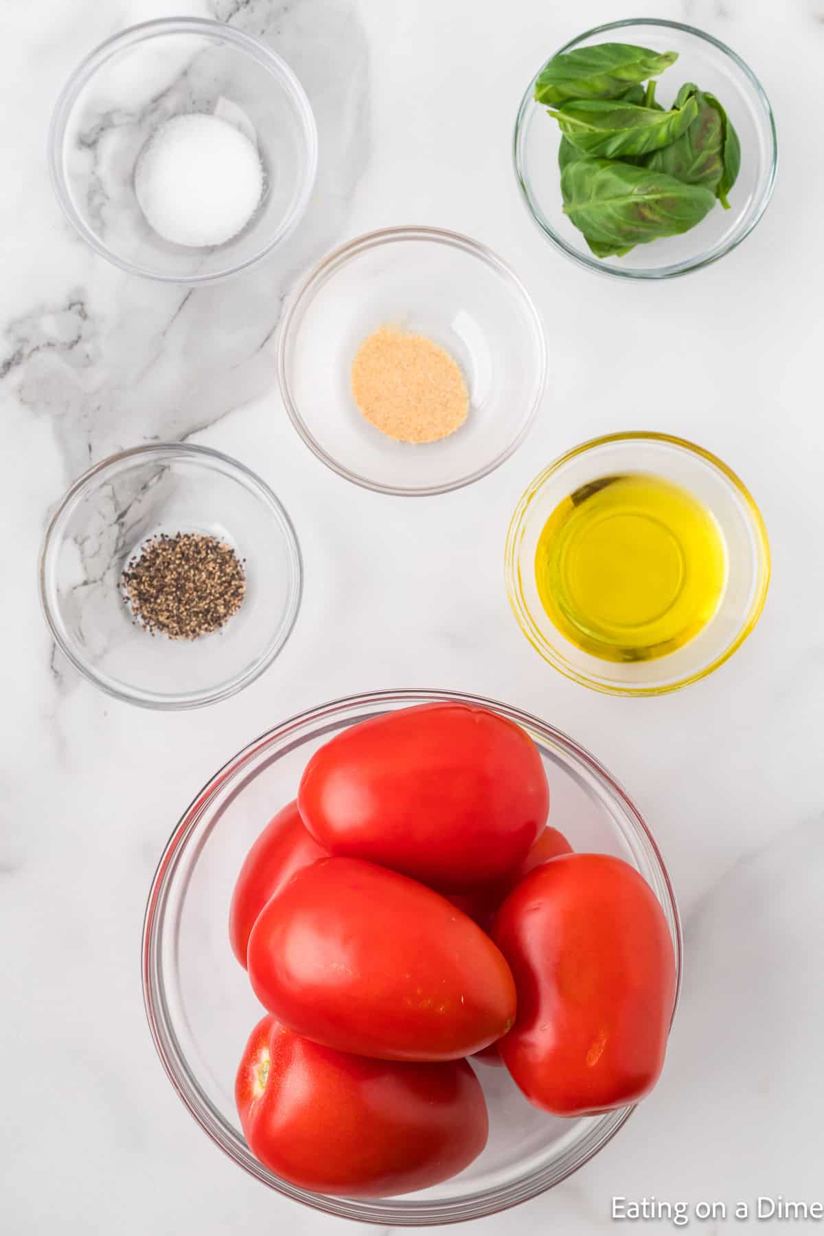 Ingredients - Roma tomatoes, pepper, salt, garlic powder, oil, basil