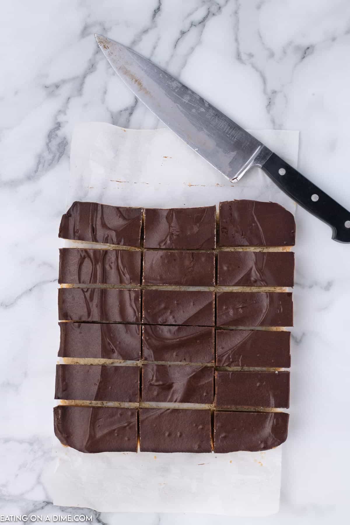 chocolate dessert cut into squares with a knife