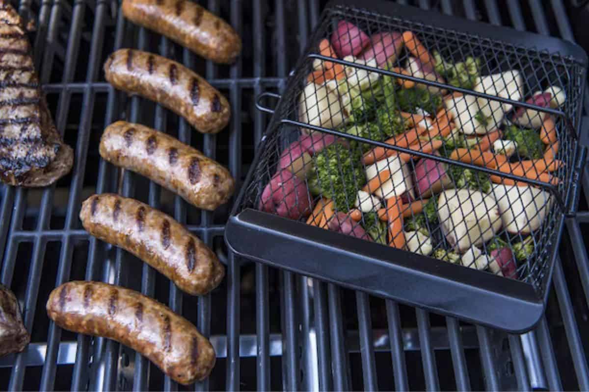 Grill basket with vegetables on a grill 