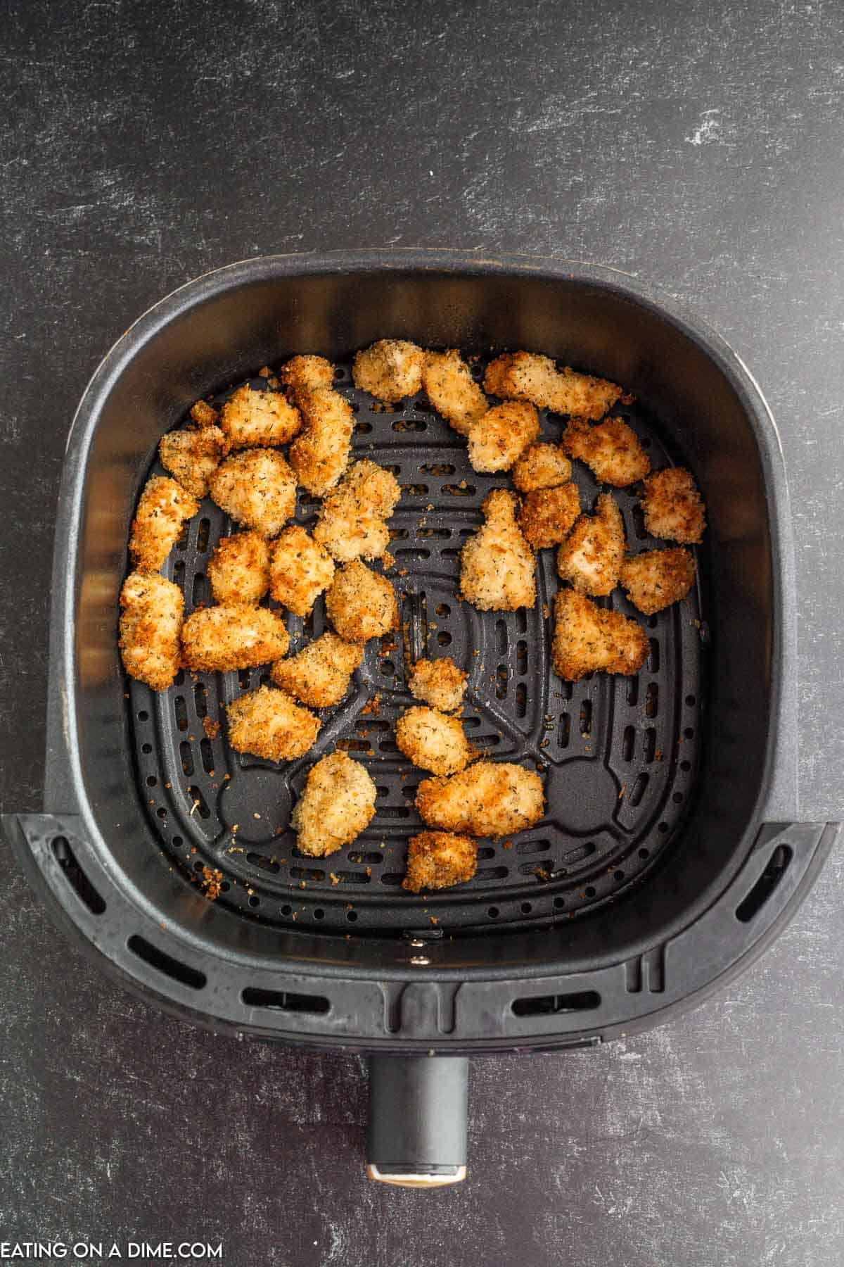 Cooked chicken nuggets in the air fryer basket