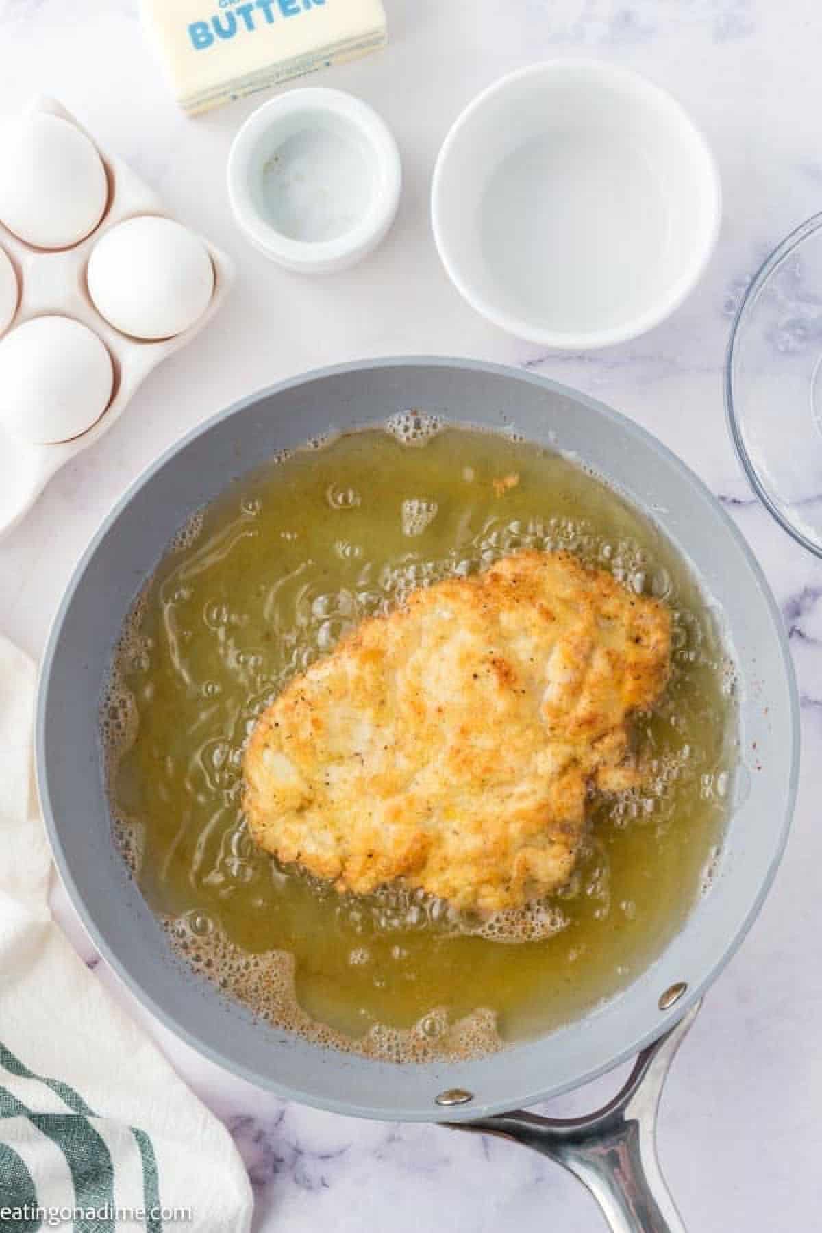 Frying chicken fried chicken in a skillet with hot oil