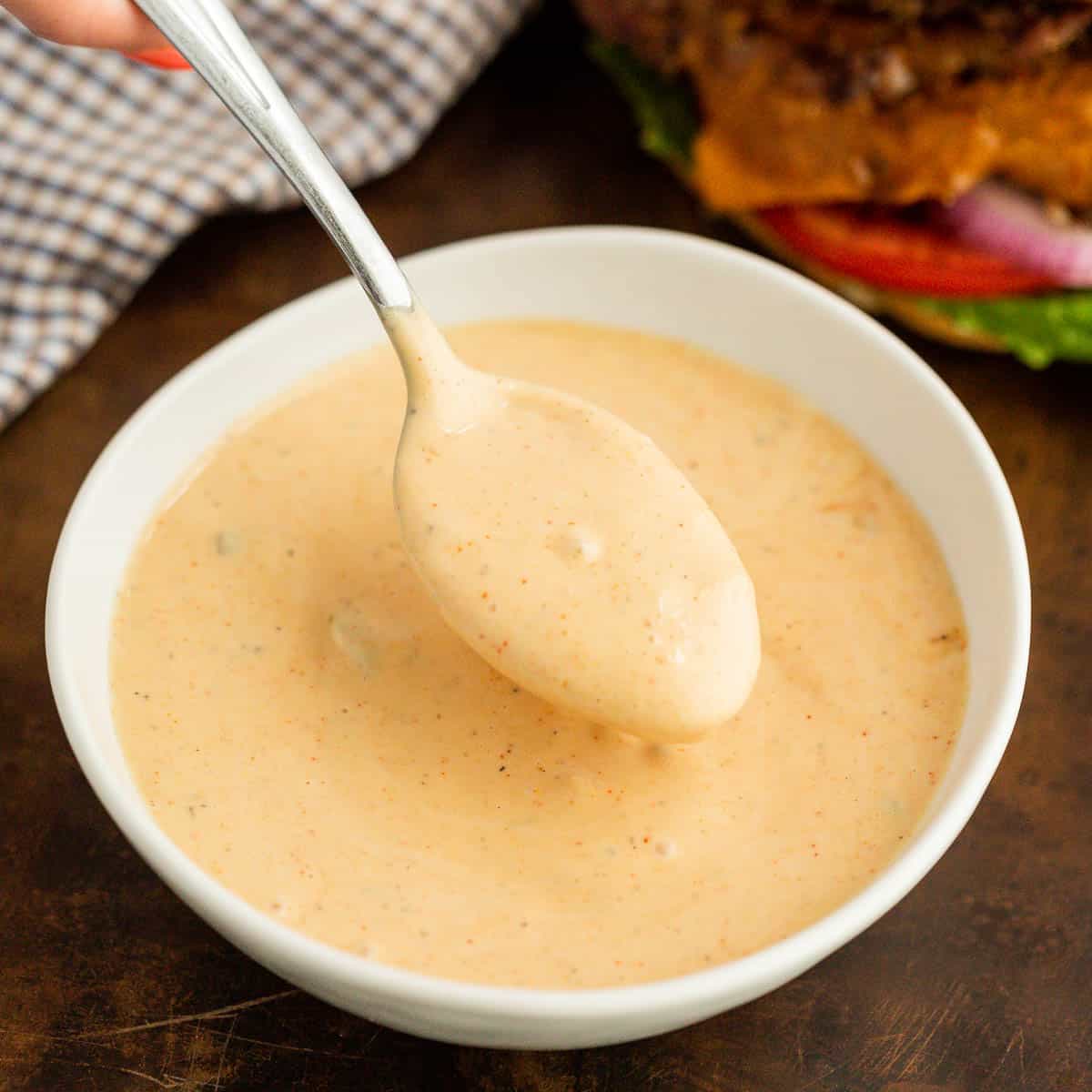 Burger sauce in a bowl with a serving on a spoon