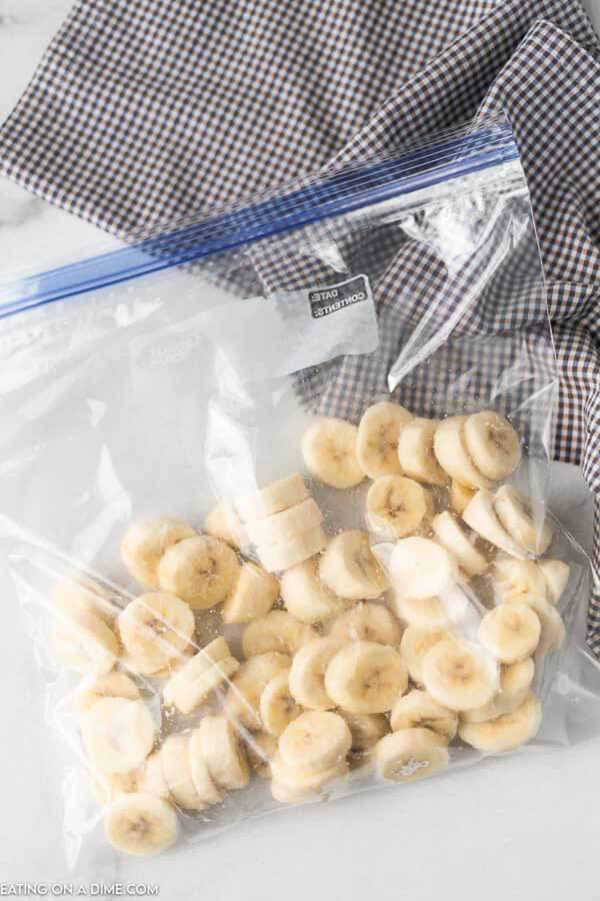 Slice bananas in a zip lock bag