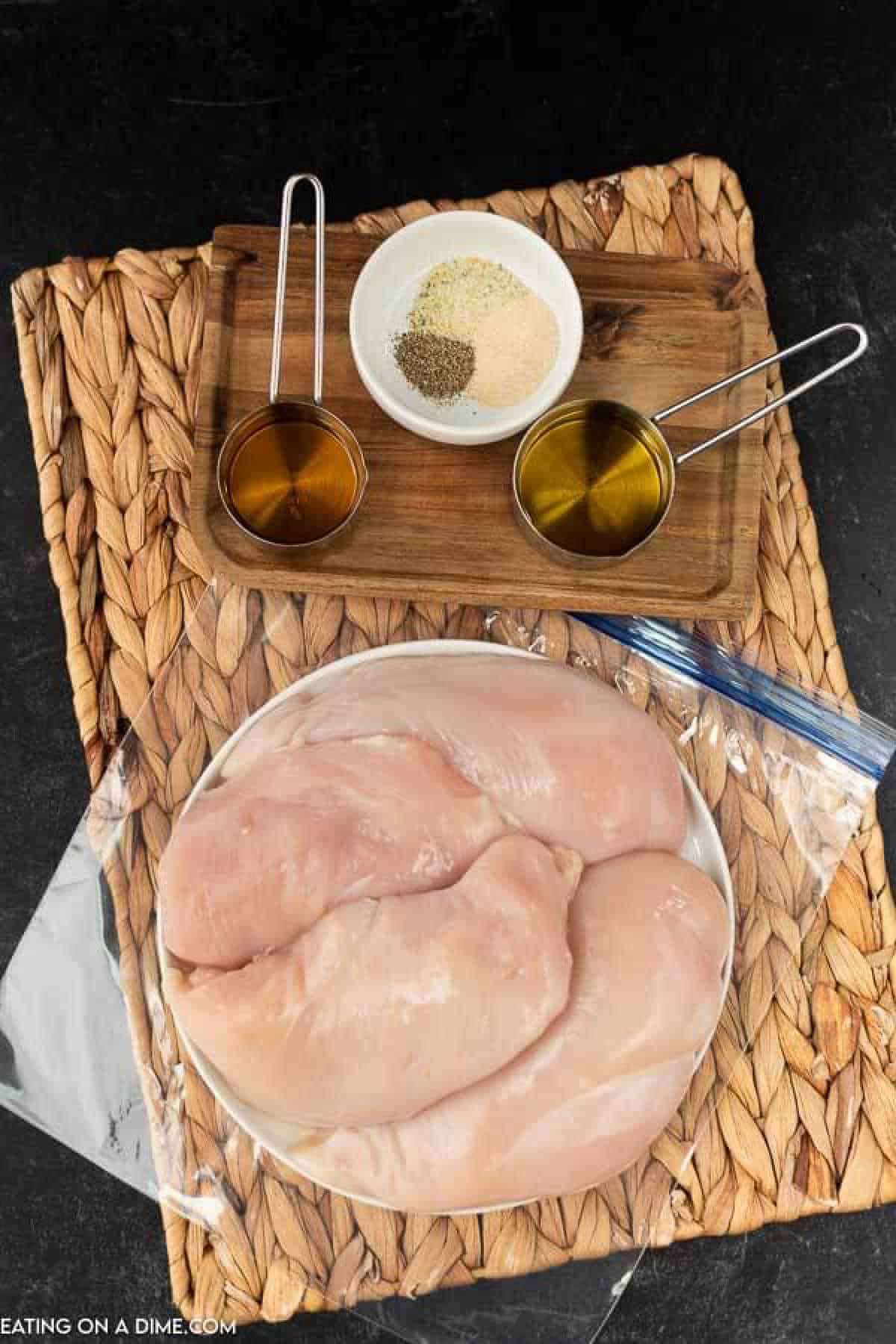 Ingredients to make the best grilled chicken marinade: chicken breasts, apple cider vinegar, olive oil, garlic salt, onion powder and pepper. 
