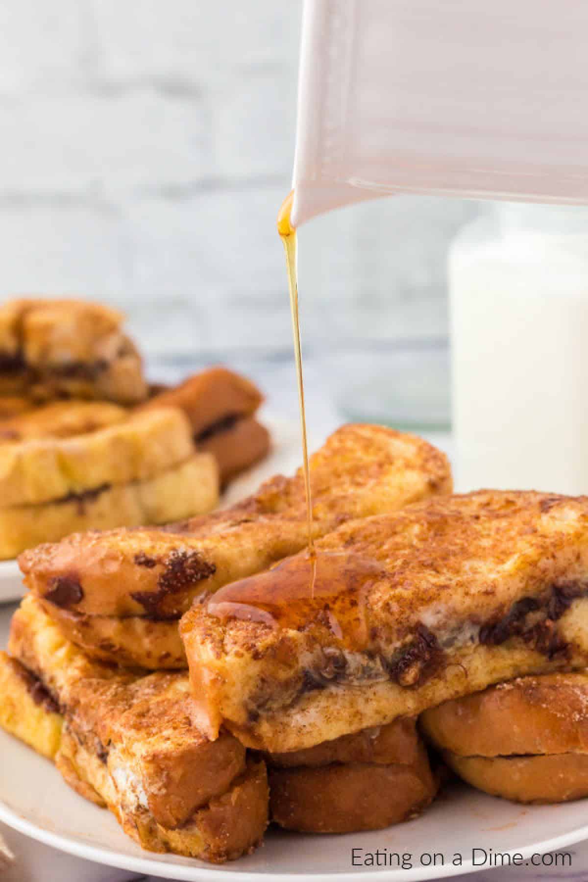 Drizzling syrup over the top of Nutella French Toast