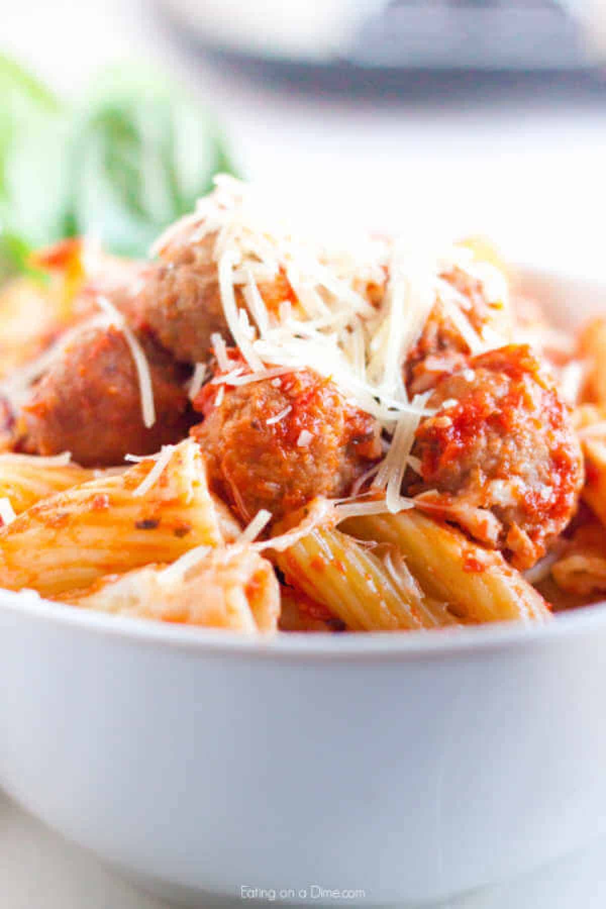up close photo of  pasta and meatballs