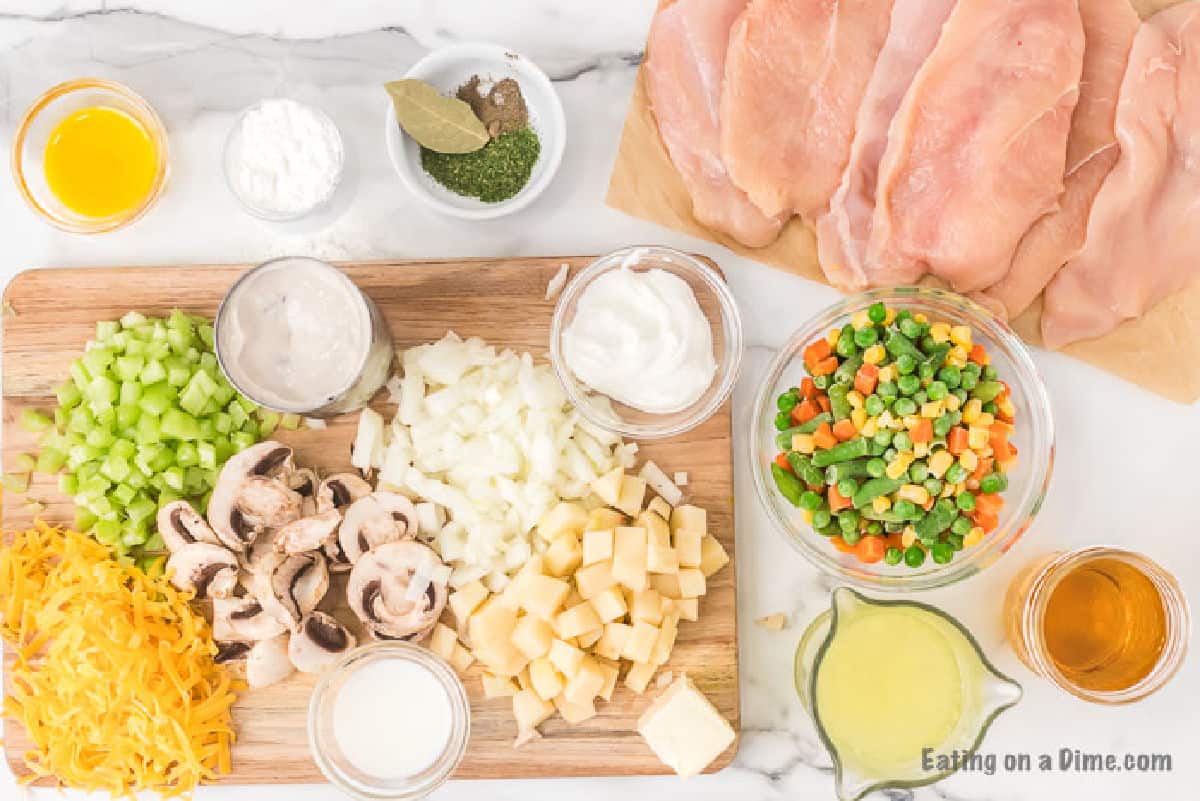 Ingredients - butter, cornstarch, seasoning, bay leaf, shredded cheese, chopped celery, slice mushrooms, cream of mushroom soup, diced potatoes and onions, chicken brown, frozen peans, carrots and corn and chicken breast