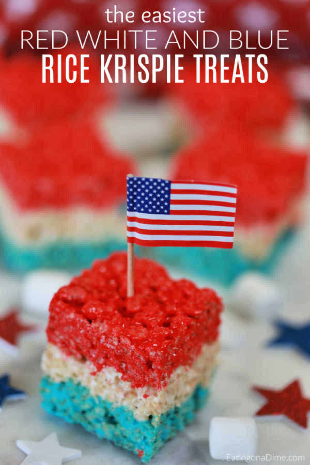 Red White and Blue Rice Krispie Treats cut into square with an American Flag party favor stuck into the treat