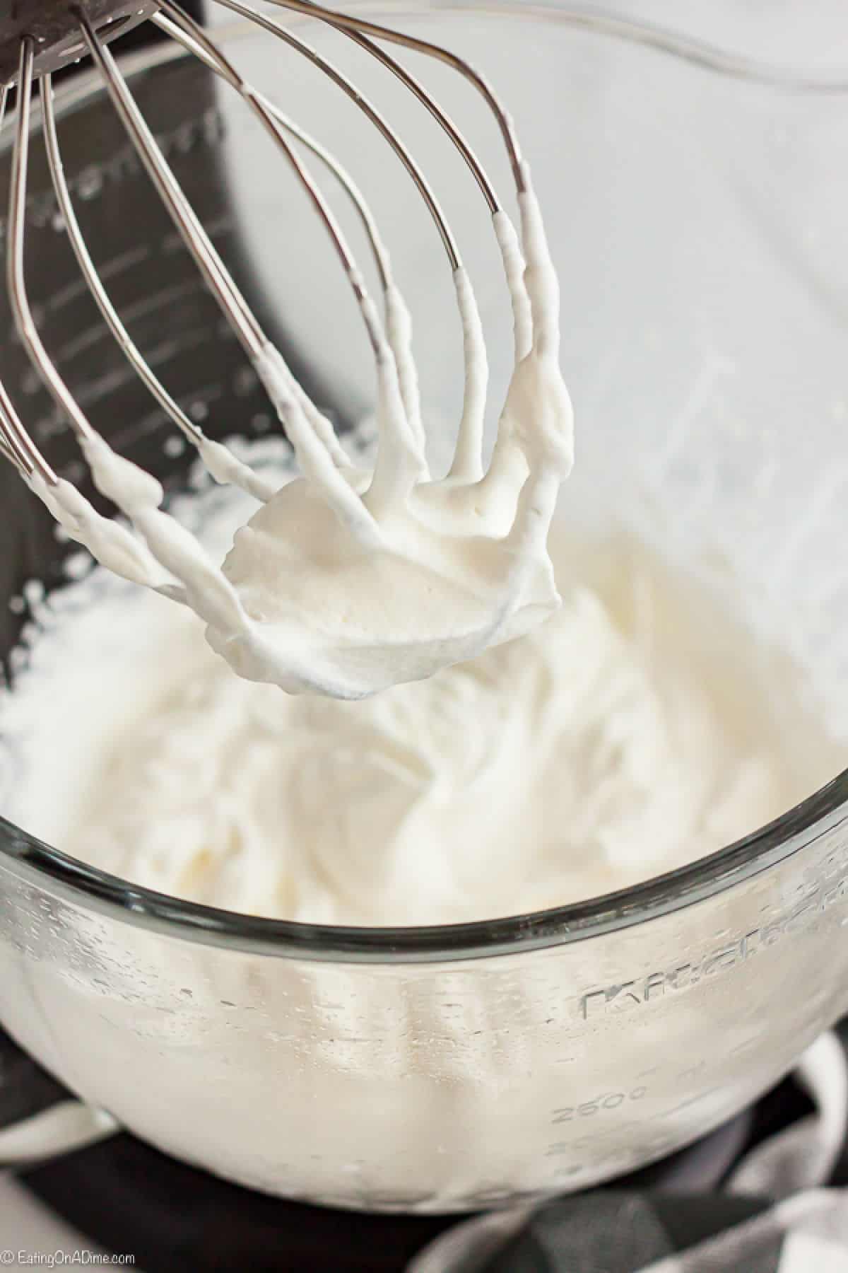 Whipped Cream in a bowl and on the beater