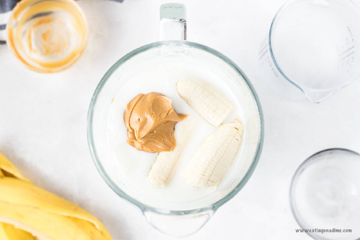 Banana, peanut butter and milk in a blender