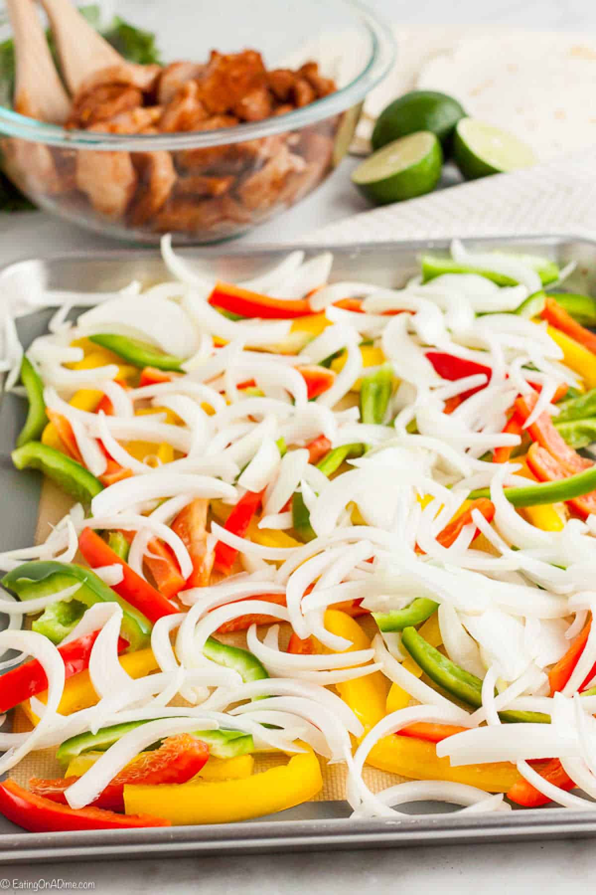 Sheet Pan Chicken Fajitas only takes a few ingredients and less than 25 minutes. Enjoy this delicious chicken mixture with tortillas or serve it alone.