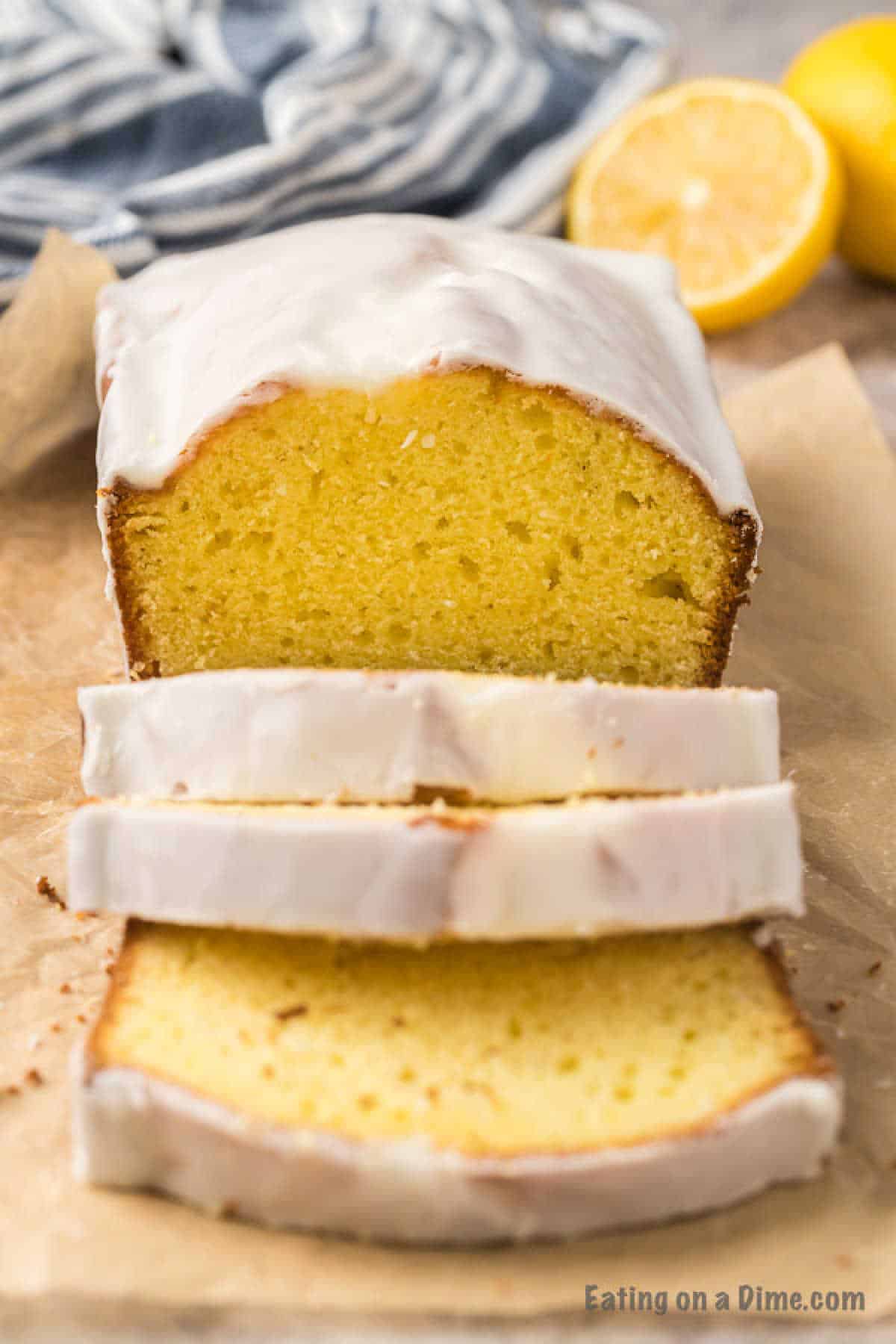 Lemon loaf sliced topped with a white glaze