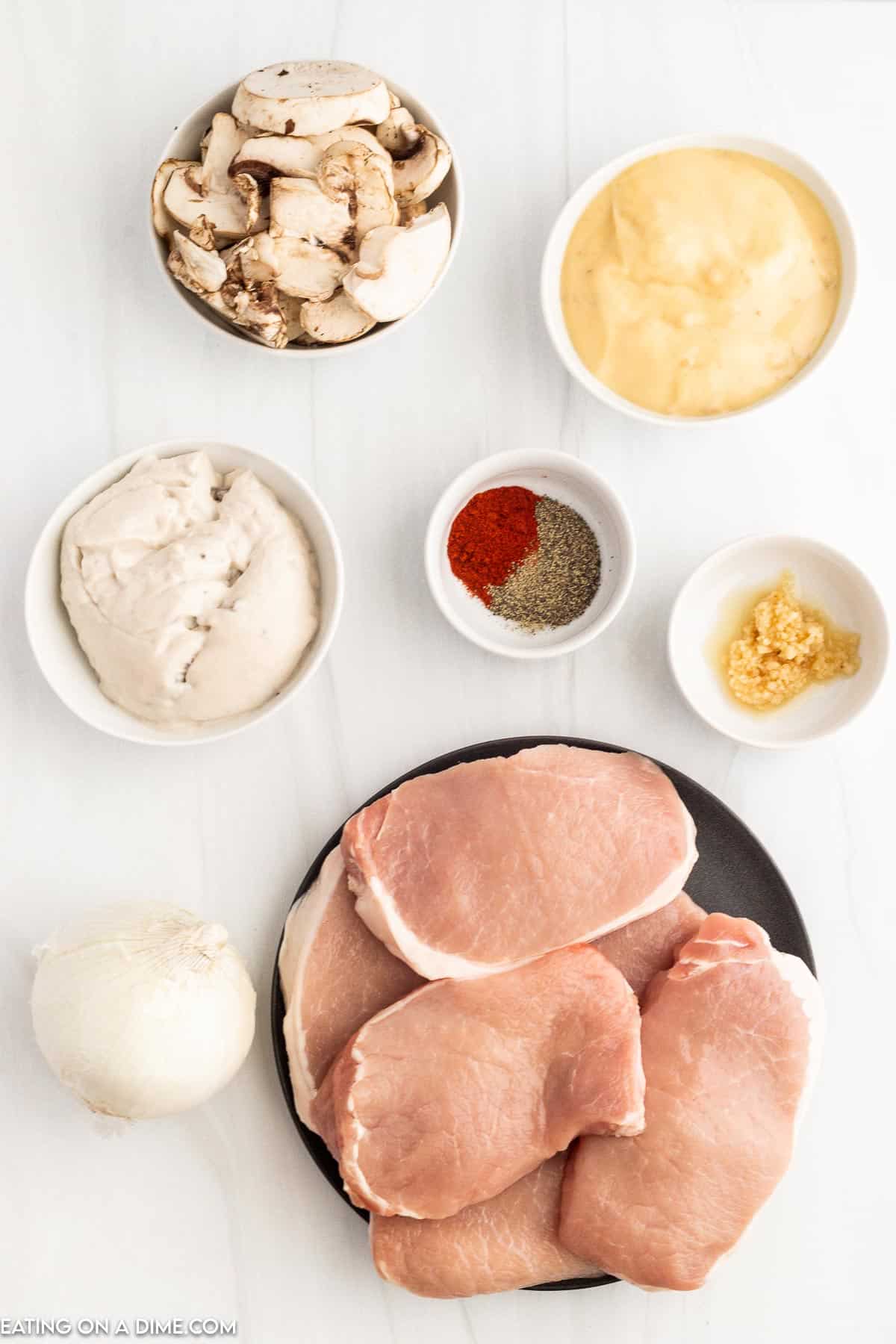 Ingredients - Slice Mushrooms, cream of chicken soup, cream of mushroom soup, minced garlic, boneless pork chops, beef broth, paprika, pepper
