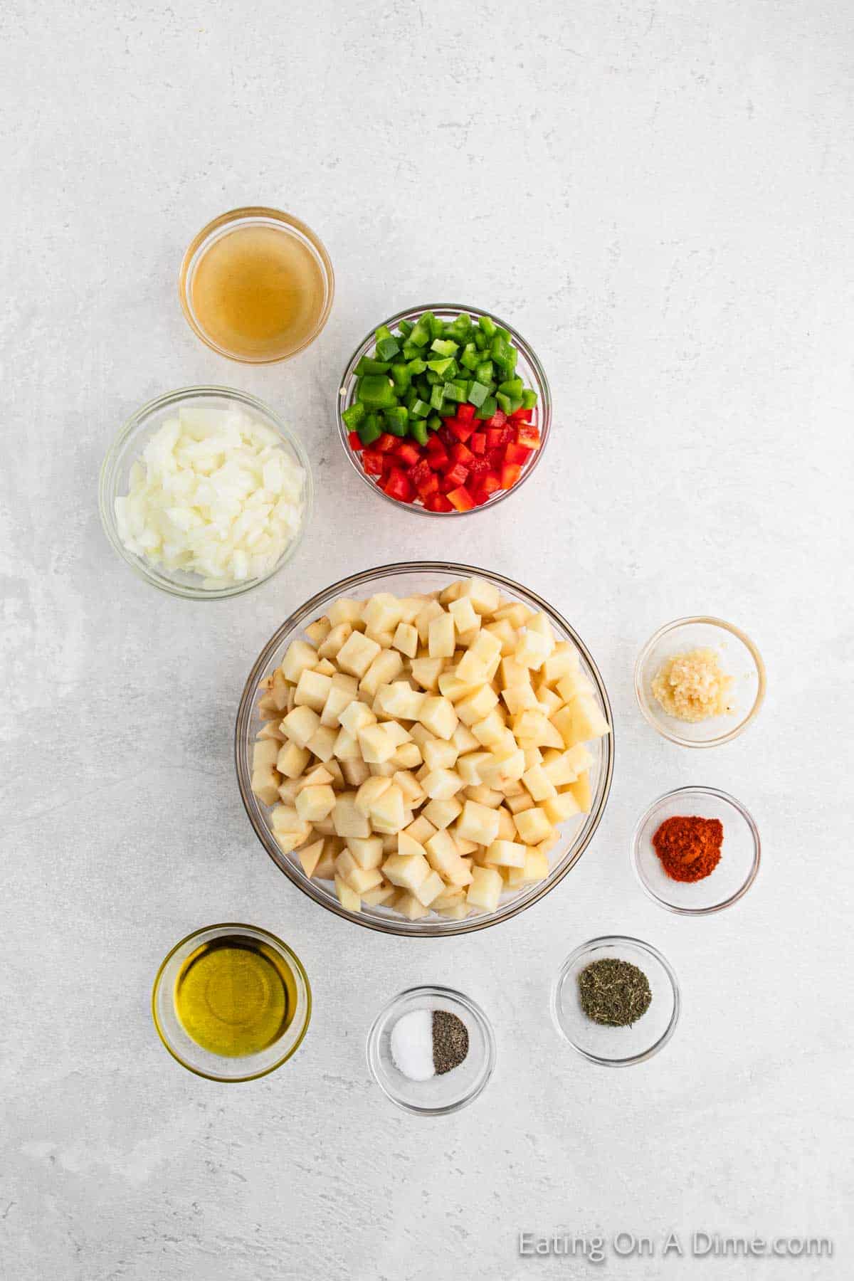 Ingredients - Potatoes, red bell pepper, green bell pepper, onion, garlic, olive oil, paprika, thyme, salt, pepper, chicken broth