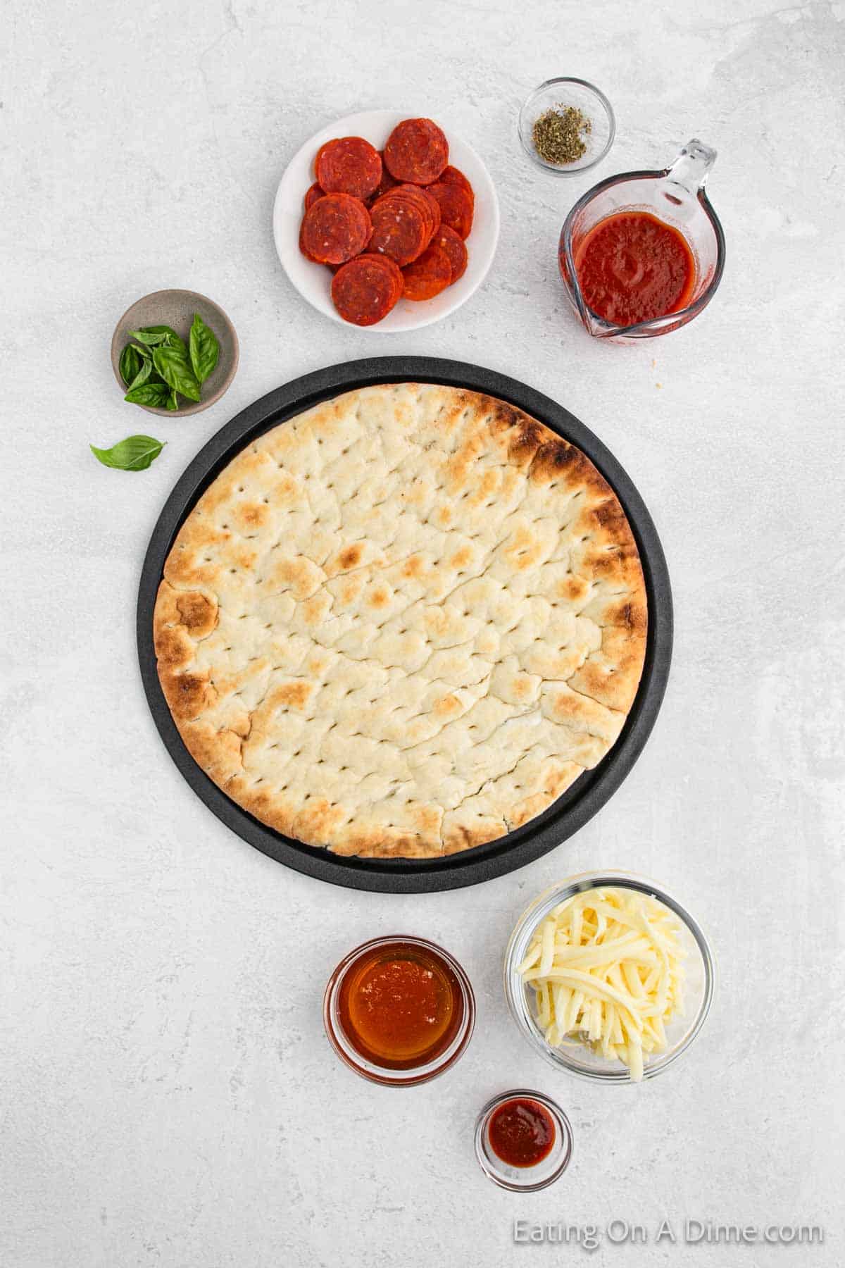 Ingredients - Pizza crust, basil, slice pepperoni, seasoning, pizza sauce, honey, shredded cheese