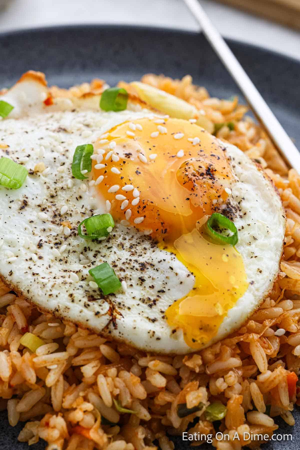 Kimchi fried rice topped with fried egg and green onions