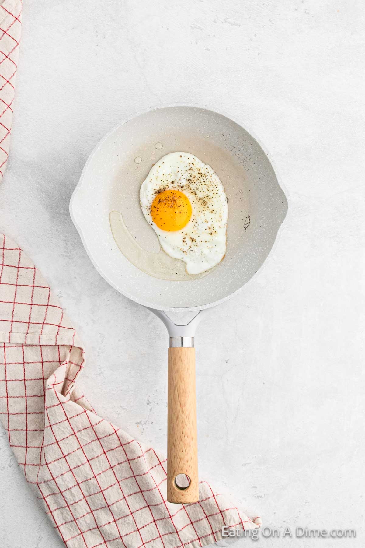 Frying egg in a skillet