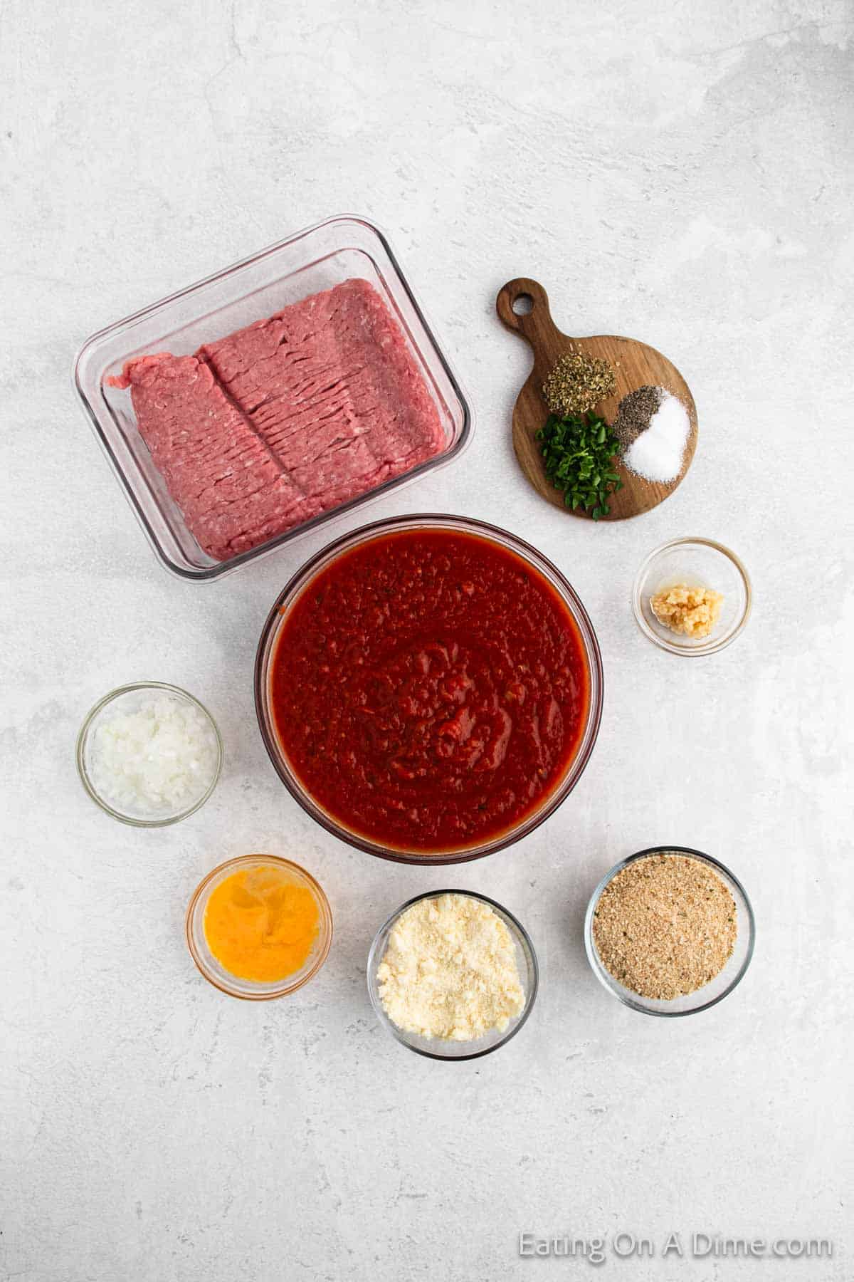 Ingredients - ground turkey, breadcrumbs, parmesan cheese, onion, garlic, fresh parsley, egg, salt, pepper, oregano, marinara sauce, fresh basil