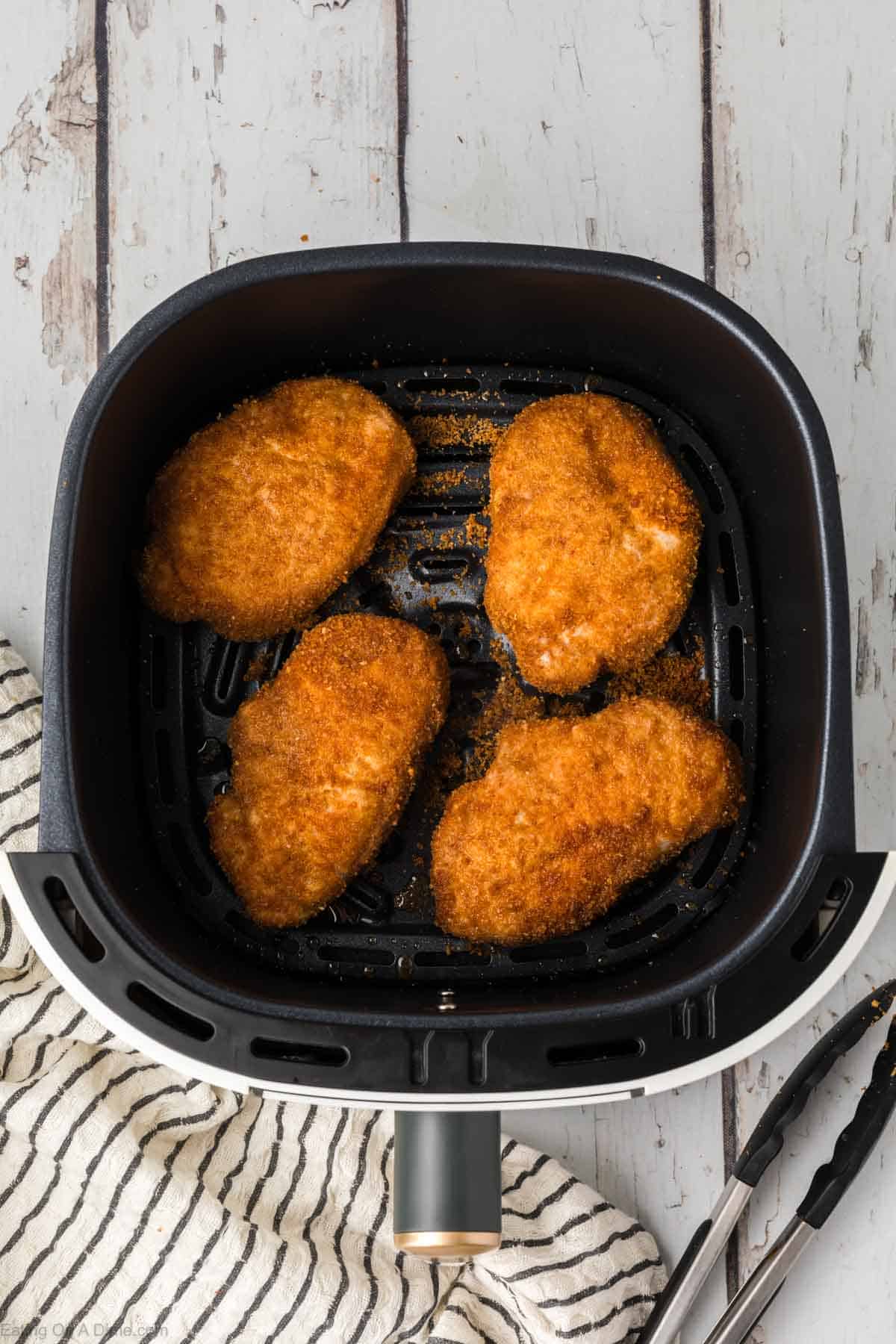 Cooked shake and bake pork chops in the air fryer basket