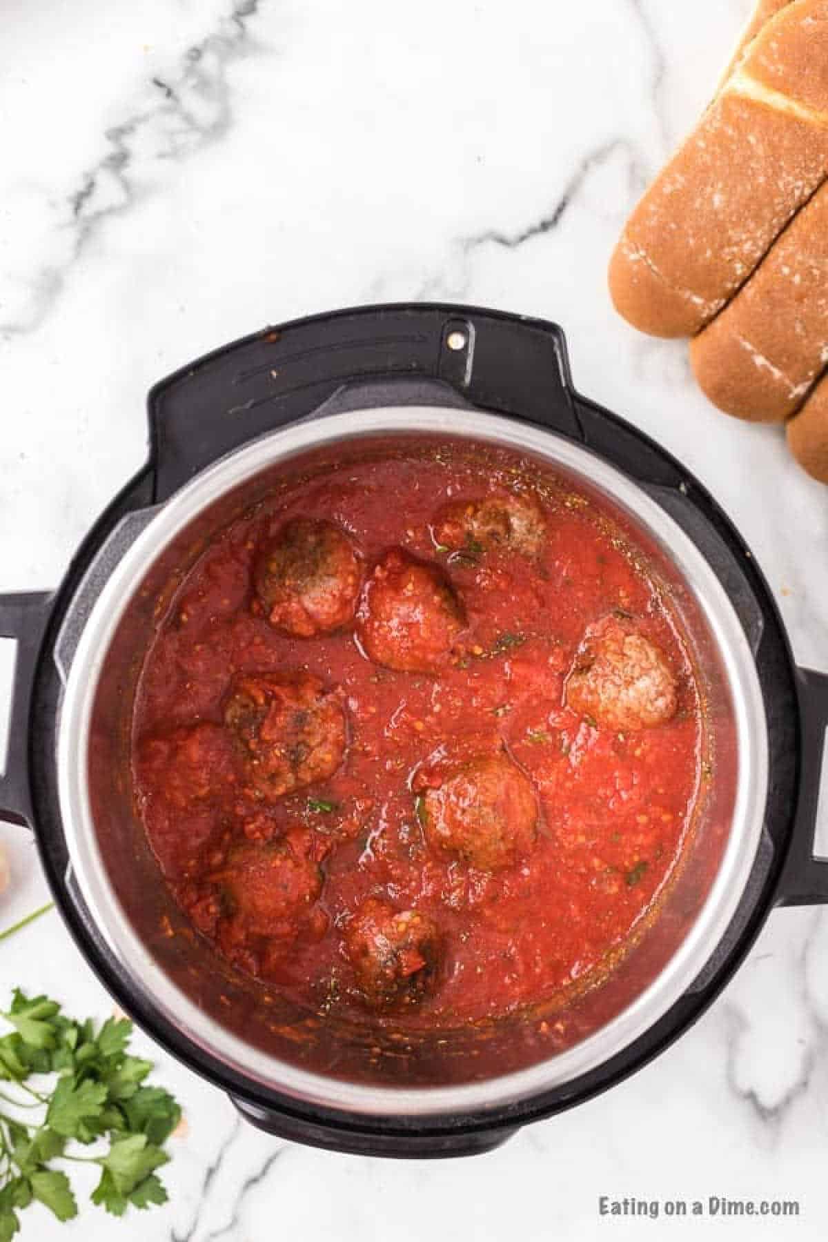 Meatballs in instant pot topped with sauce mixture